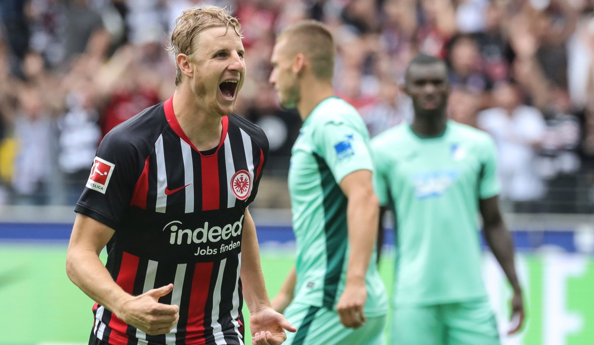 epa07779306 Frankfurt's Martin Hinteregger (L) celebrates scoring the opening goal during the German Bundesliga soccer match between Eintracht Frankfurt and TSG Hoffenheim in Frankfurt Main, Germany, 18 August 2019.  EPA/ARMANDO BABANI CONDITIONS - ATTENTION: The DFL regulations prohibit any use of photographs as image sequences and/or quasi-video