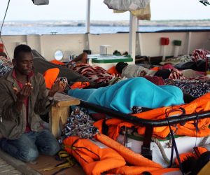 epa07780159 A migrant, one of the 107 on board the Spanish rescue vessel Open Arms, prays during morning hours, off Lampedusa Island, southern Italy, 19 August 2019. Two days after 27 minors and sick migrants were evacuated, the rescue vessel continues stranded off the coast of Italy as it waits to reach a safe port in the Mediterranean sea, despite the Lazio Regional Administrative Court accepted its appeal, suspending the ban on entry into Italian waters ordered by Italian Interior Minister Matteo Salvini.  EPA/FRANCISCO GENTICO