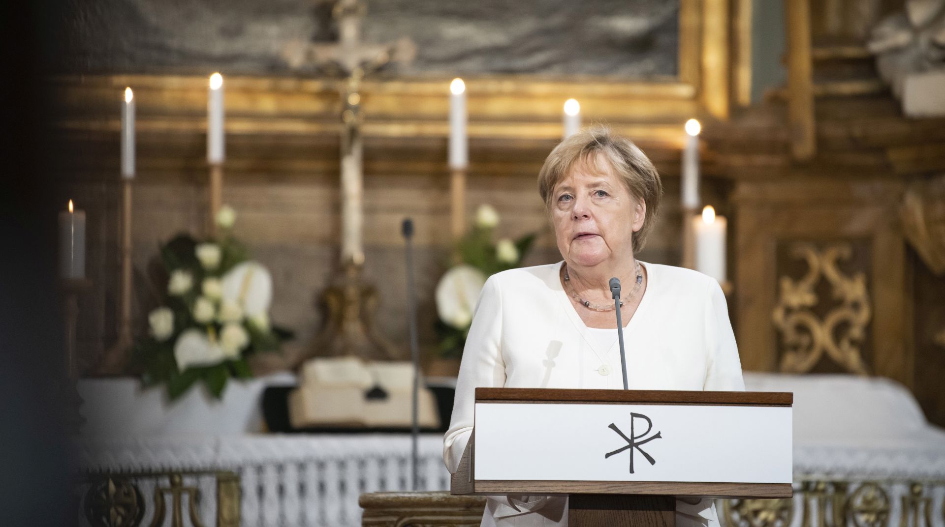 epa07780388 A handout photo made available by the German Federal Government (Bundesregierung) shows German Chancellor Angela Merkel delivering a speech in the Evangelical Church of Sopron on the occasion of the 30th anniversary of the pan-European picnic, in Sopron, Hungary, 19 August 2019. Merkel is in Sopron to attend the 30th anniversary of the beginning of the dismantling of the iron curtain between Hungary and Austria.  EPA/GUIDO BERGMANN/GERMAN FEDERAL GOVERNMENT HANDOUT  HANDOUT EDITORIAL USE ONLY/NO SALES