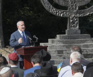 epa07780856 Israeli Prime Minister Benjamin Netanyahu speaks during a mourning ceremony joint with Ukrainian President Volodymyr Zelensky (not pictured) next the Minora monument near the Babiy Yar ravine in Kiev, Ukraine, 19 August 2019. Some 34,000 Jews were murdered in the Babiy Yar ravine by Nazis during two days in September 1941. In total more than 100,000 people lost their lives in Babiy Yar between 1941 and 1943. Benjamin Netanyahu is on a two-day official visit to Kiev to meet with top Ukrainian officials.  EPA/SERGEY DOLZHENKO
