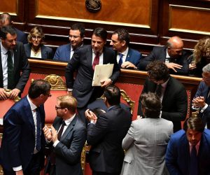 epa07782246 Italian Premier Giuseppe Conte (C) arrives to deliver a speech at the Senate in Rome, Italy, 20 August 2019 as Deputy Premier and Interior Minister Matteo Salvini (L) looks on. Conte in his address called bringing about the government crisis  irresponsible. Salvini and his party League pulled out from government and caused a political crisis a week ago.  EPA/ETTORE FERRARI