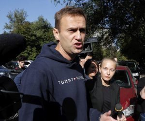 epa07787301 Russian opposition politician Alexei Navalny talks to members of the media as he leaves a prison after serving a 30-day sentence in Moscow, Russia, 23 August 2019.  Alexei Navalny was detained 24 July near his apartment building when he came out for a jog, on charges of violation law in the organization of an unauthorized public event.  EPA/MAXIM SHIPENKOV