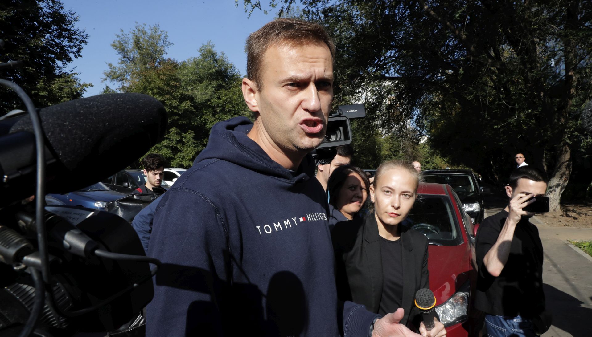 epa07787301 Russian opposition politician Alexei Navalny talks to members of the media as he leaves a prison after serving a 30-day sentence in Moscow, Russia, 23 August 2019.  Alexei Navalny was detained 24 July near his apartment building when he came out for a jog, on charges of violation law in the organization of an unauthorized public event.  EPA/MAXIM SHIPENKOV