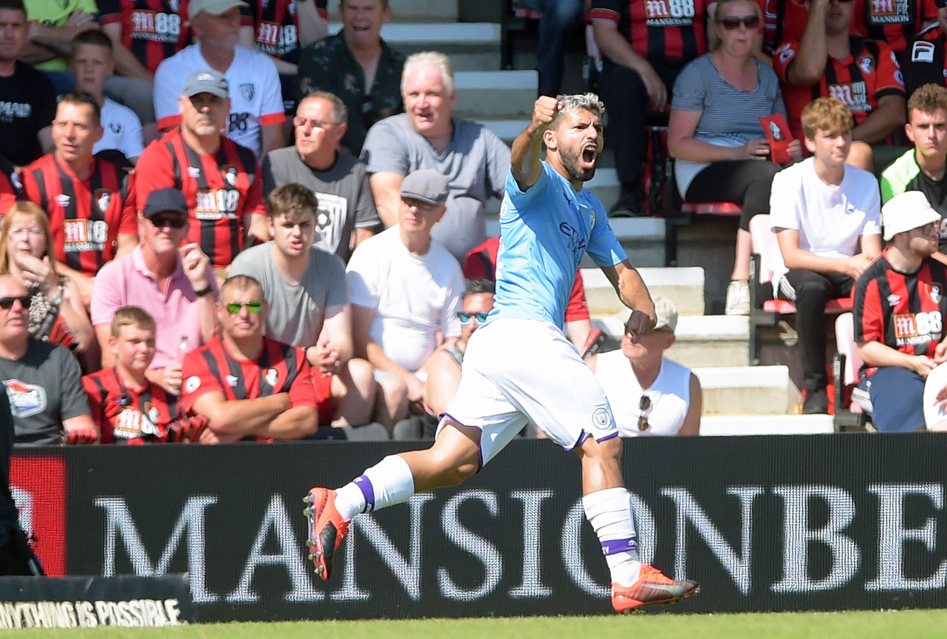 epa07792888 Manchester City's Sergio Aguero celebrates after scoring the opening goal during the English Premier League soccer match between AFC Bournemouth and Manchester City in Bournemouth, Britain, 25 August 2019.  EPA/GERRY PENNY EDITORIAL USE ONLY. No use with unauthorized audio, video, data, fixture lists, club/league logos or 'live' services. Online in-match use limited to 120 images, no video emulation. No use in betting, games or single club/league/player publications