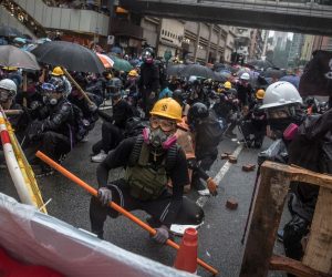 epa07793412 Protesters wearing gas masks in action against the police during an anti-government rally in Tsuen Wan, in Hong Kong, China, 25 August 2019. The protests were triggered by an extradition bill to China in June, now suspended, and evolved into a wider anti-government movement with no end in sight.  EPA/ROMAN PILIPEY
