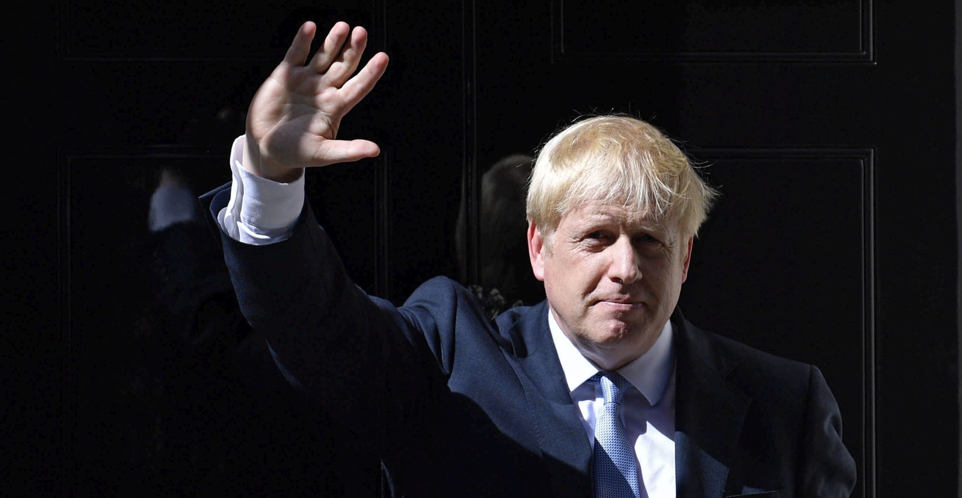 epa07798938 (FILE) - British Prime Minister Boris Johnson waves as he enters 10 Downing Street following his appointment by the Queen in London, Britain, 24 July 2019 (re-issued 28 August 2019). According to reports, British government has formally requested the intervention of the Queen in a bid to suspend parliament. A government source said the government's intention is to suspend parliament and hold a Queen's speech 14 October, setting out the future plans of a post-Brexit government.  EPA/NEIL HALL