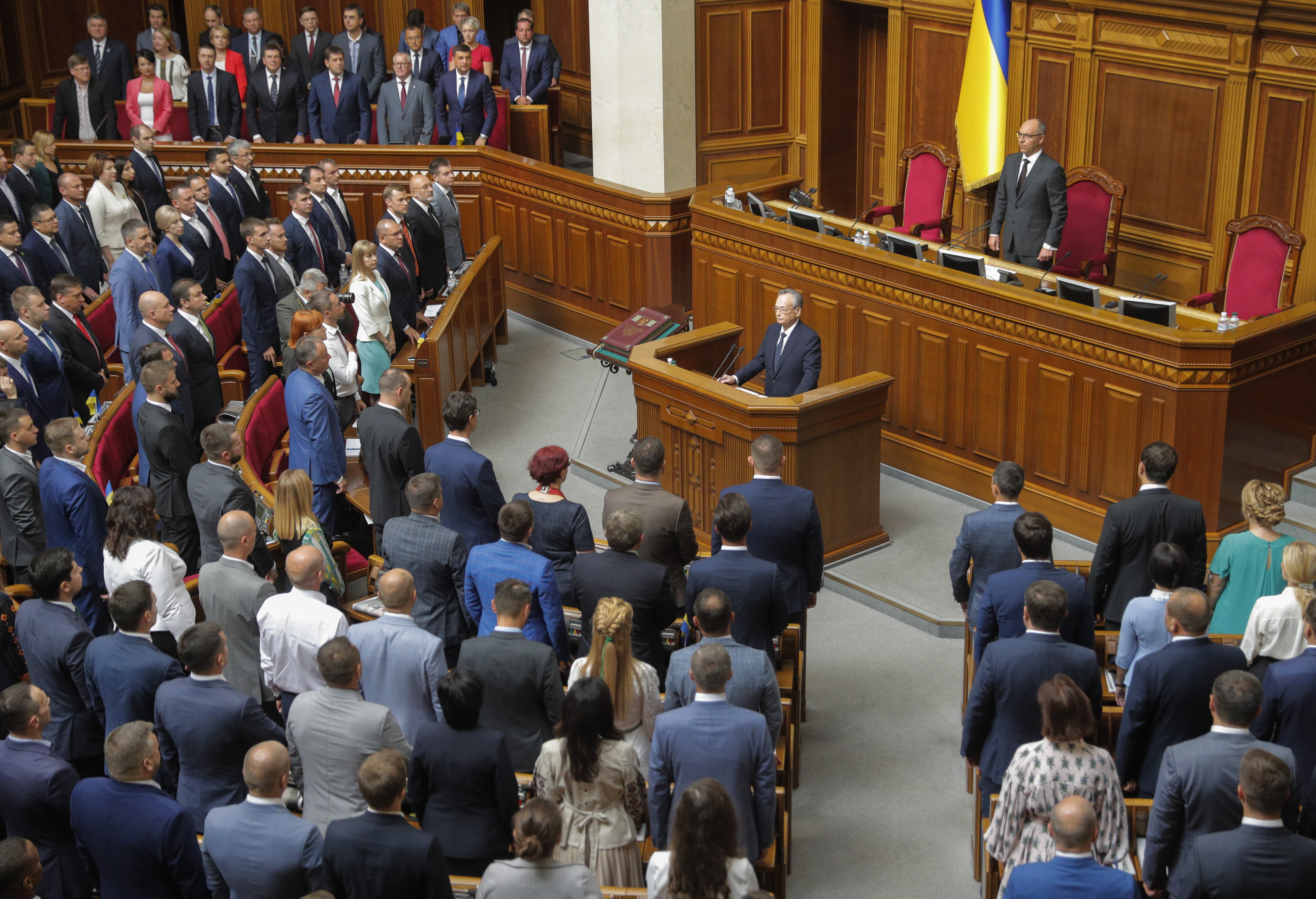 epa07800606 Newly elected deputies take the oath of office during a session of the Ukrainian Parliament in Kiev, Ukraine, 29 August 2019. It was the first parliamentary session following the general elections in the country. Ukrainians took part in the parliamentary elections on 21 July 2019 after President Volodymyr Zelensky dissolved previous parliament during his inauguration on 21 May 2019.  EPA/SERGEY DOLZHENKO
