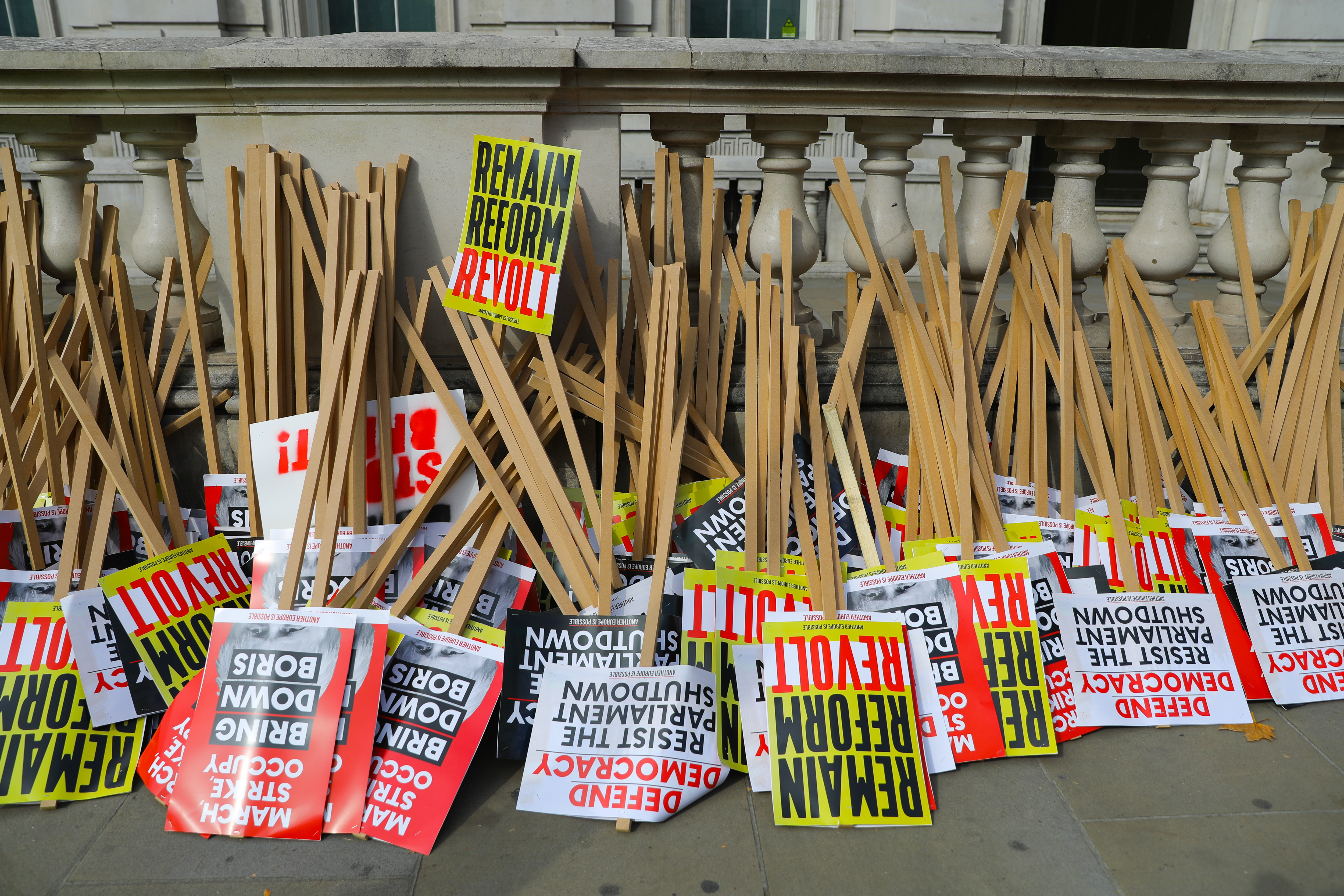 epa07806228 Placards lay on the ground outside Downing Street in Whitehall ahead of a protest against Brexit and the prorogation of parliament in London, Britain, 31 August 2019. A number of 'Stop The Coup' protests are taking place across Britain today against Prime Minister Boris Johnson's move to suspend parliament.  EPA/VICKIE FLORES