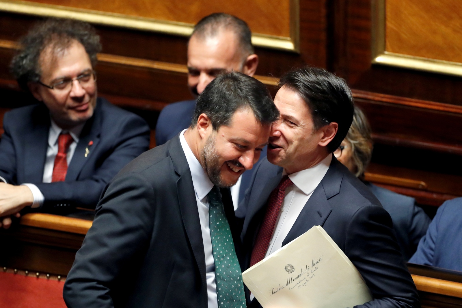 Italian Prime Minister Giuseppe Conte addresses the upper house of parliament over the ongoing government crisis, in Rome Italian Prime Minister Giuseppe Conte speaks with Italian Deputy PM Matteo Salvini before addressing the upper house of parliament over the ongoing government crisis, in Rome, Italy August 20, 2019. REUTERS/Yara Nardi     TPX IMAGES OF THE DAY YARA NARDI