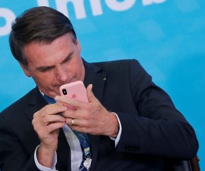 Brazilian President Jair Bolsonaro uses a cellphone during the launching ceremony of the real estate credit program at the Planalto Palace in Brasilia Brazilian President Jair Bolsonaro uses a cellphone during the launching ceremony of the real estate credit program at the Planalto Palace in Brasilia, Brazil, August 20, 2019. REUTERS/Adriano Machado ADRIANO MACHADO