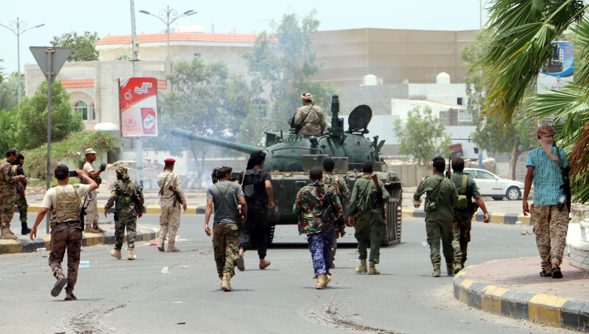 epa07766728 Armed members of a separatist southern group patrol a street during clashes with government forces in the southern port city of Aden, Yemen, 10 August 2019. According to reports, separatist forces in southern Yemen, backed by the United Arab Emirates, have seized all military bases belonging to the Saudi-backed Yemeni government in the southern city of Aden after four days of fighting between the two sides.  EPA/NAJEEB ALMAHBOOBI