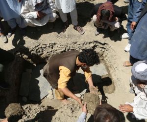 epa07778848 Afghan men put soil on a grave, a day after a suicide attack targeted a wedding hall in Kabul, Afghanistan, 18 August 2019. According to the latest reports at least 63 people were killed and 182 is wounded.  EPA/JAWAD JALALI