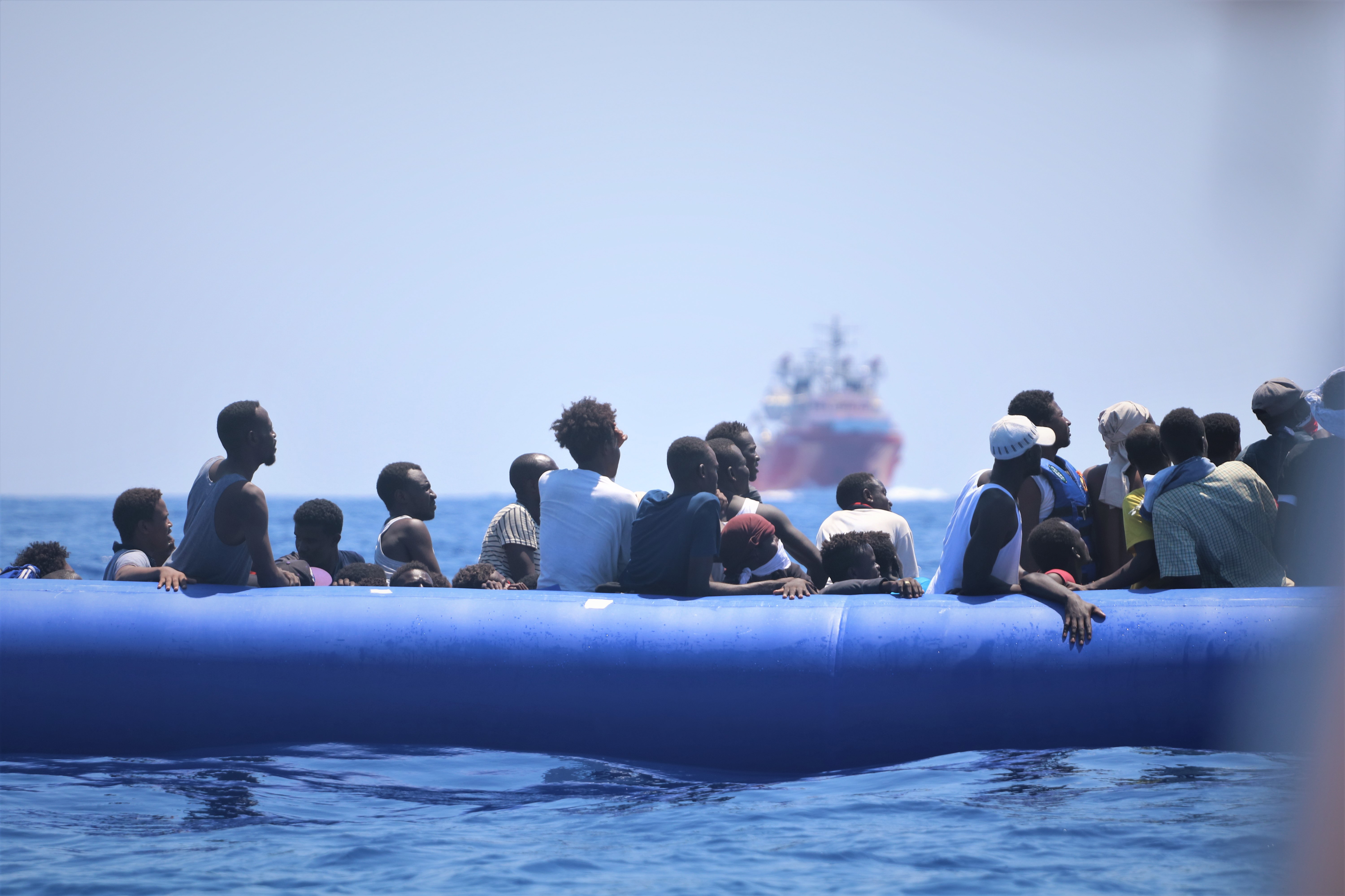 epa07780685 A handout photo dated 12 August 2019 and  made available by Doctors Without Borders (MSF) on 19 August 2019, showing migrants on a rubber dinghy waiting for their rescue by the rescue vessel Ocean Viking off the coast of Libya in the Mediterranean. The vessel, that has been at sea since 10 days, rescued a total of 356 migrants in three rescue missions. Over 500 refugees on two NGO vessels are still waiting to be allowed at land while Italy and Malta have denied them access to their harbors.  EPA/HANNAH WALLACE BOWMAN HANDOUT  HANDOUT EDITORIAL USE ONLY/NO SALES