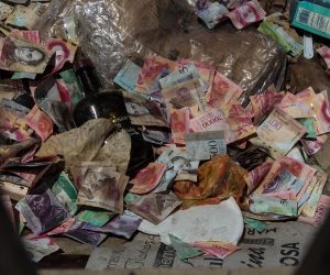 epa07783150 View of several Venezuelan bills of different denominations in the garbage, in Maracaibo, Venezuela, 18 August 2019 (issued 21 August 2019). Hyperinflation and the loss of purchasing power of the Venezuelan bolivar  are a reality in the South American country, a year after the implementation of an economic recovery plan designed by the government of President Nicolas Maduro.  EPA/MIGUEL GUTIERREZ