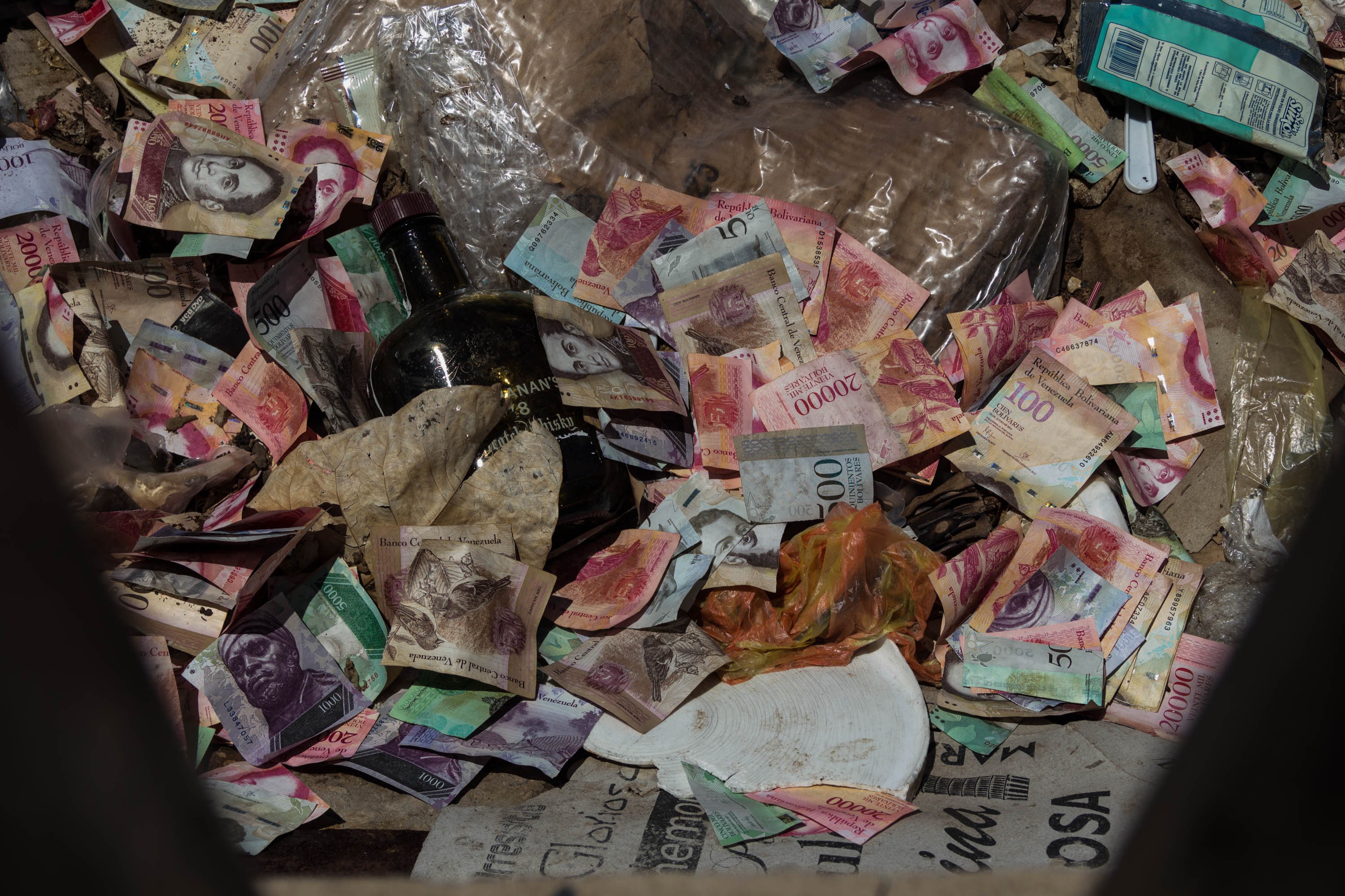epa07783150 View of several Venezuelan bills of different denominations in the garbage, in Maracaibo, Venezuela, 18 August 2019 (issued 21 August 2019). Hyperinflation and the loss of purchasing power of the Venezuelan bolivar  are a reality in the South American country, a year after the implementation of an economic recovery plan designed by the government of President Nicolas Maduro.  EPA/MIGUEL GUTIERREZ