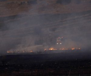 epa07811184 Lebanese firefighters extinguish the fire caused by Israeli shell as seen from the Israeli side of the border near the village of  village of Avivim, 01 September 2019. According to reports, tension between Israel and Lebanese militant group Hezbollah continues to escalate since last week following strikes on targets in Syria and Israeli drones fell over southern suburb of Beirut.  Hezbollah fired  anti-tank missile fire towards an Israeli army  base next to  the village of Avivim on the Israeli-Lebanese  border with no injured , in  responded Israeli army  launching approximately 100 artillery shells at the sources of the fire.  EPA/ATEF SAFADI