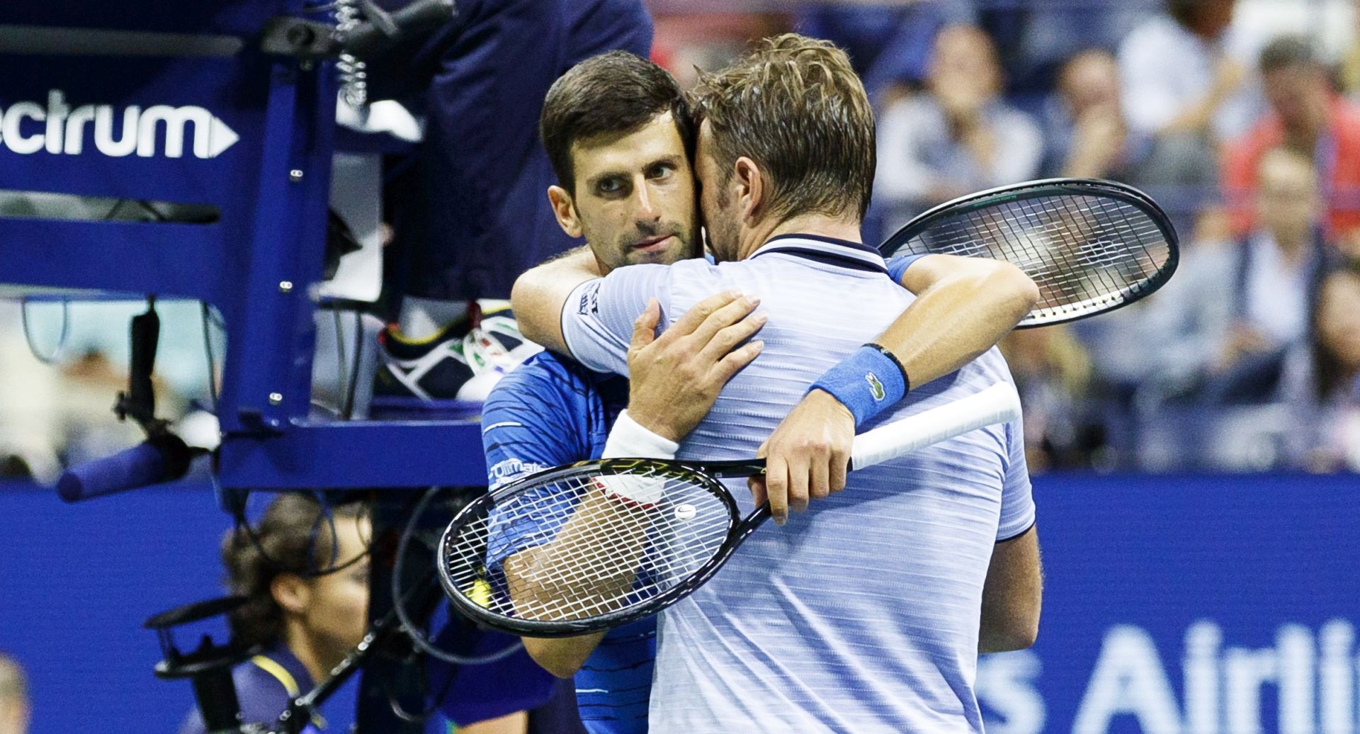 epa07811916 Novak Djokovic (L) of Serbia embraces Stan Wawrinka (R) of Switzerland after Djokovic retired in the third set during a match on the seventh day of the US Open Tennis Championships the USTA National Tennis Center in Flushing Meadows, New York, USA, 01 September 2019. The US Open runs from 26 August through to 08 September 2019.  EPA/JUSTIN LANE