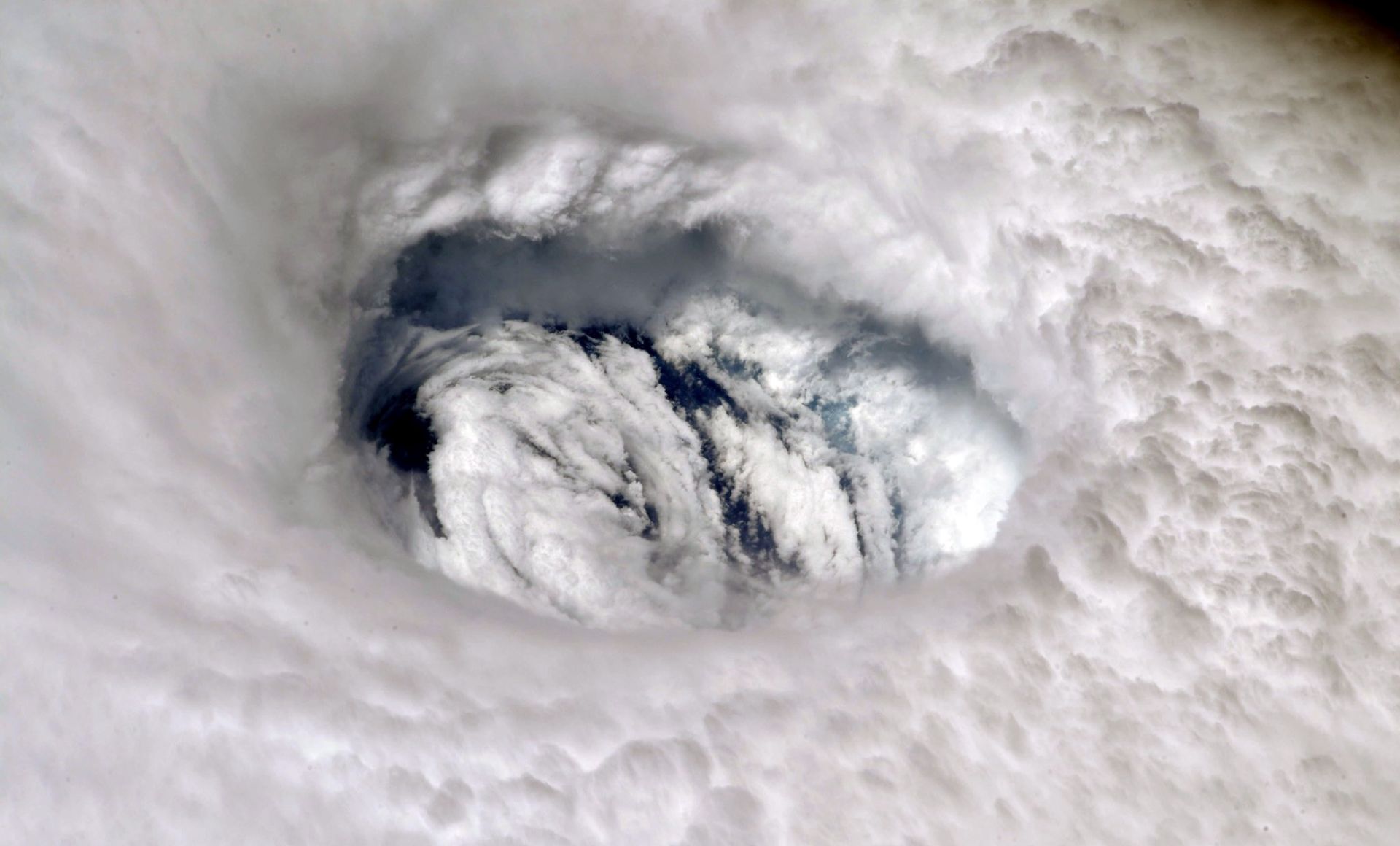 epa07814007 A handout photo made available by NASA shows an image of Hurricane Dorian's eye taken by NASA astronaut Nick Hague, from aboard the International Space Station (ISS), 02 September 2019. The station orbits more than 200 miles above the Earth. Hurricane Dorian, which made landfall on the Bahamas as category 5 and now reclassified as category 4, is expected to continue on its projected path towards the Florida coast in the upcoming days.  EPA/NASA HANDOUT  HANDOUT EDITORIAL USE ONLY/NO SALES