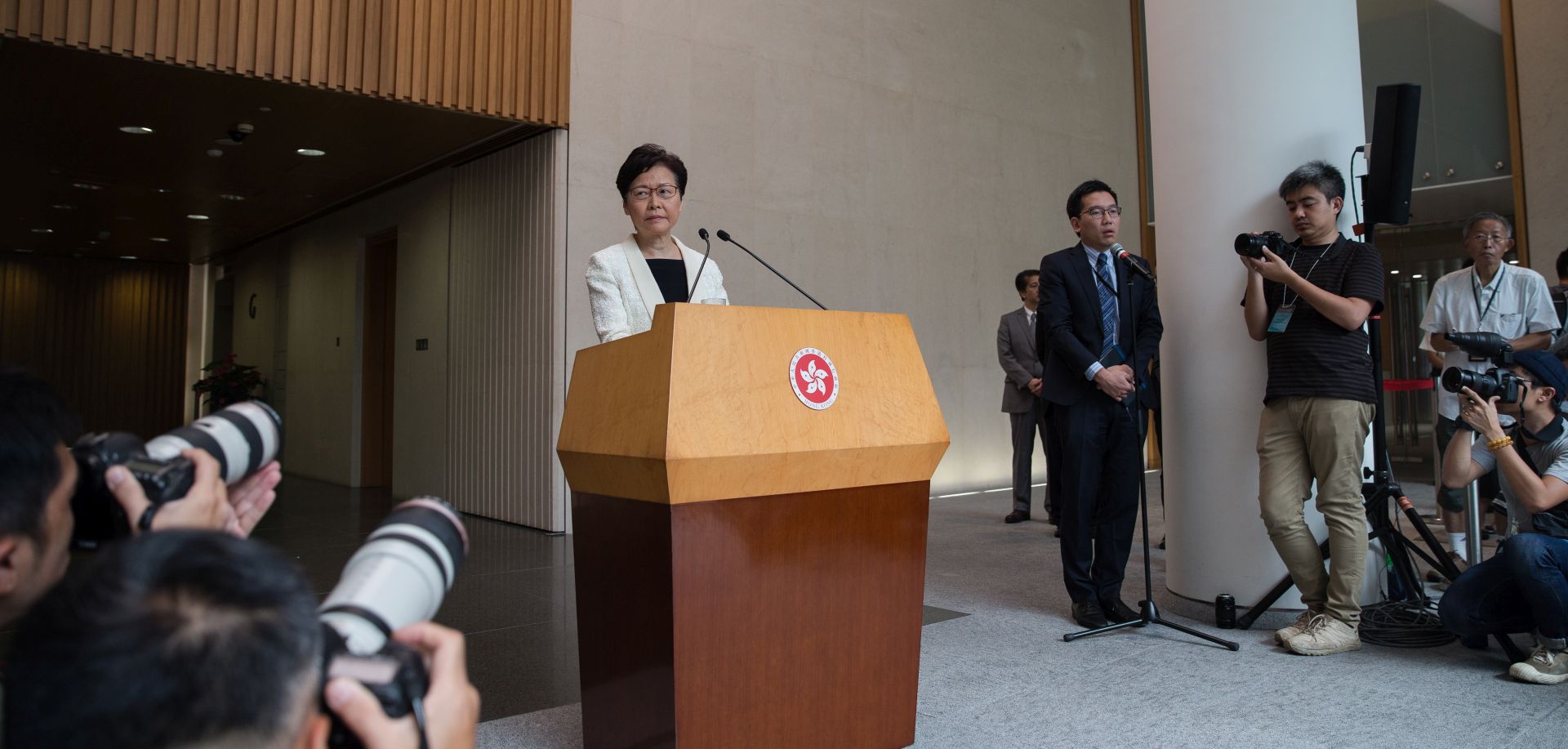 epa07813937 Hong Kong Chief Executive Carrie Lam (C) attends a press conference at the government offices in Hong Kong, China, 03 September 2019. According to reports Lam has told a group of business leaders that she's sorry for the 'unforgivable havoc' caused by her attempts to pass the extradition bill, while admitting she had limited scope to resolve the crisis as Sino-US tensions increase. Hong Kong has been gripped by mass protests since June over a now-suspended extradition bill that have morphed into a wider anti-government movement.  EPA/JEROME FAVRE