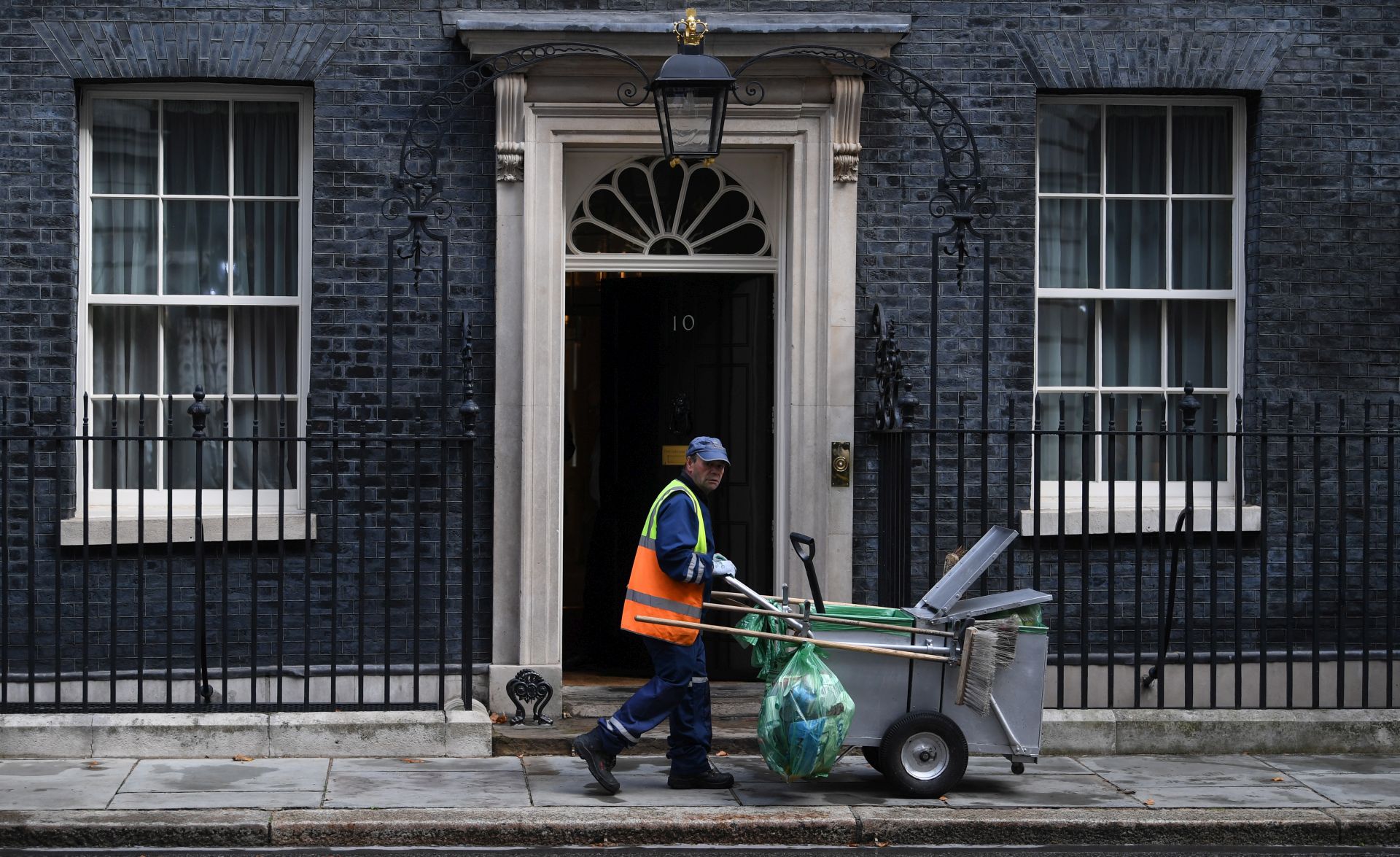 epa07816290 A street cleaner in Downing Street, central London, Britain, 04 September 2019. Members of Parliament will vote on a bill forcing Britain's Prime Minister Boris Johnson to delay Brexit unless MPs back a new deal or vote for a no-deal exit. The Prime Minister will table a motion to call for a general election if that bill passes  EPA/NEIL HALL