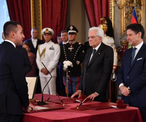 epa07818661 Italian Minister of Foreign Affairs Luigi Di Maio (L) stands in front of Italian Premier Giuseppe Conte (R) and President Sergio Mattarella (C) during the new government's swearing-in at Quirinal Palace, Rome, Italy, 05 September 2019. Italian Prime Minister Giuseppe Conte's new government is a coalition between the anti-establishment 5-Star Movement (M5S) and the center-left Democratic Party (PD) that will have 21 ministers, 10 from the M5S, nine from the PD and one from the small leftwing Free and Equal (LeU) party, media reported.  EPA/ALESSANDRO DI MEO