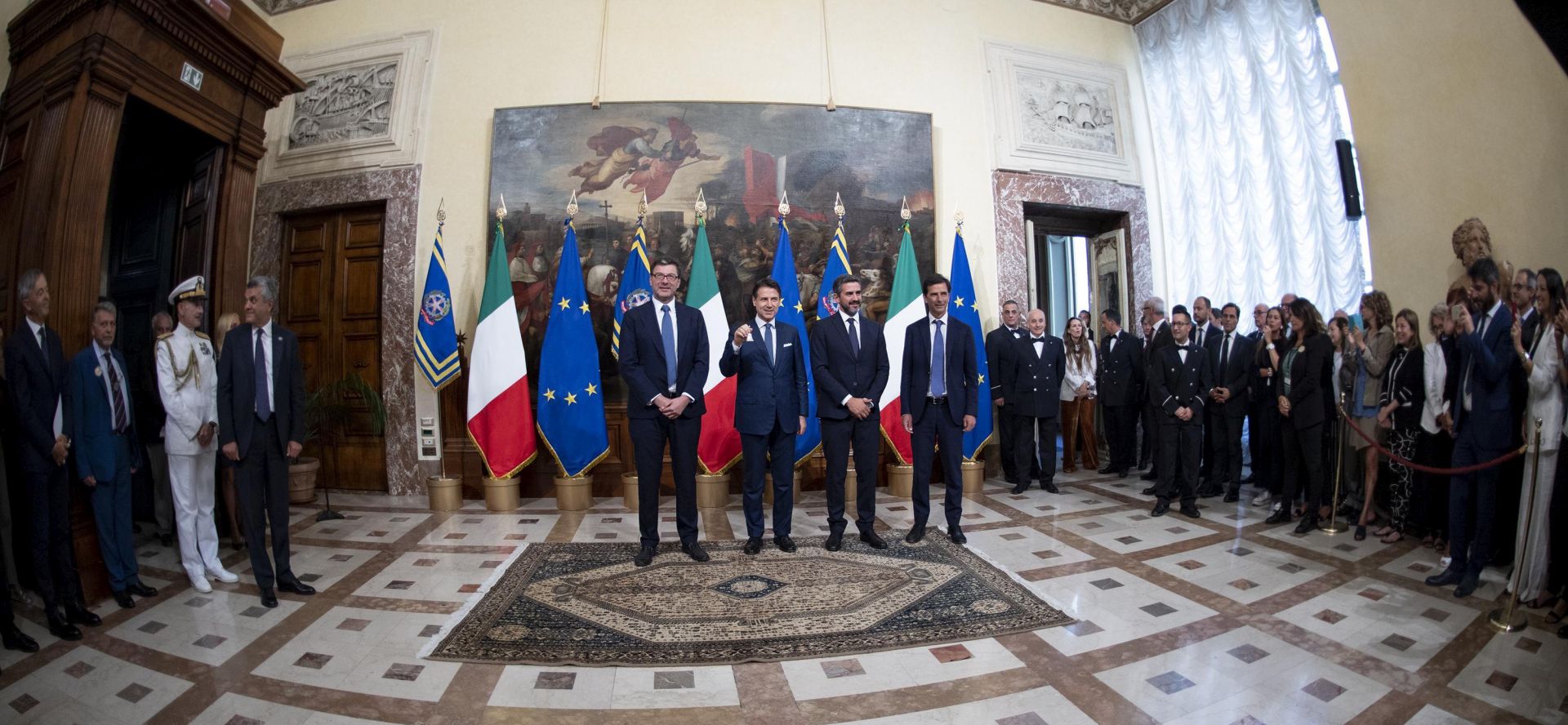 epa07819752 Italian Premier Giuseppe Conte (2-L) during the bell ceremony with former cabinet secretary Giancarlo Giorgetti (L), his successor in that role Riccardo Fraccaro (2-R) and Chigi Palace general secretary Roberto Chieppa (R), Rome, Italy, 05 September 2019. Conte's new government is a coalition between the anti-establishment 5-Star Movement (M5S) and the center-left Democratic Party (PD) that will have 21 ministers, 10 from the M5S, nine from the PD and one from the small leftwing Free and Equal (LeU) party, media reported.  EPA/MAURIZIO BRAMBATTI