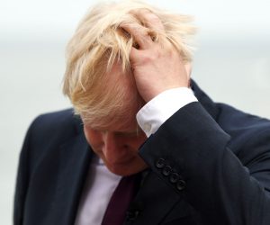 epa07823061 (FILE) - Britain's Prime Minister Boris Johnson reacts during a TV interview ahead of bilateral meetings as part of the G7 summit in Biarritz, France, 25 August 2019  (reissued 06 September 2019). According to media reports, the British House of Lords approved the new law against a no-deal Brexit on 06 September 2019.  EPA/NEIL HALL
