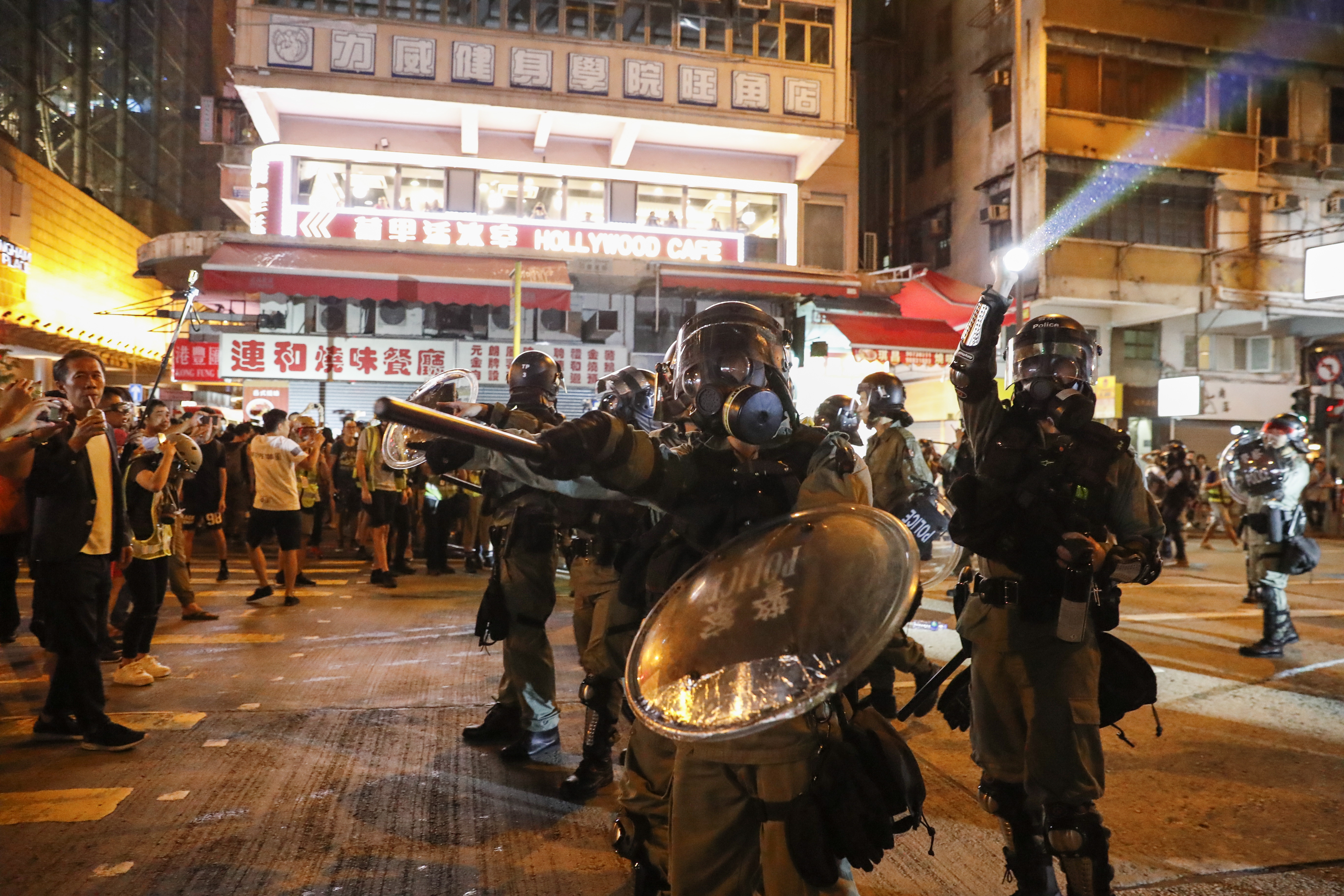 epa07823012 Riot police advance to disperse protesters attending a rally against police's violence at Mong Kok, in Hong Kong, China, 06 September 2019. Hong Kong Chief Executive Carrie Lam announced on 05 September the withdrawal of a controversial extradition bill that could allow the transfer of criminal suspects to mainland China after three months of protests across the territory. The full withdrawal of the bill, which was introduced in April and then suspended in June, is one of five key demands of protesters, who are demanding for full democratic rights.  EPA/JEON HEON-KYUN
