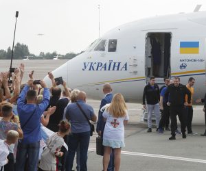 epa07825314 Relatives and journalists meet Ukrainian prisoners as Ukrainian President Volodymyr Zelensky (R) greets them after the plane with freed prisoners landed in Boryspil International Airport near of Kiev, Ukraine, 07 September 2019. The 35 political prisoners and Ukrainian sailors were freed during Russia-Ukraine prisoner swap 35x35. The swap list includes 24 sailors captured by Russia in the Kerch Strait, and 11 more convicts, including Ukrainian film director Oleh Sentsov, as local media report.  EPA/SERGEY DOLZHENKO