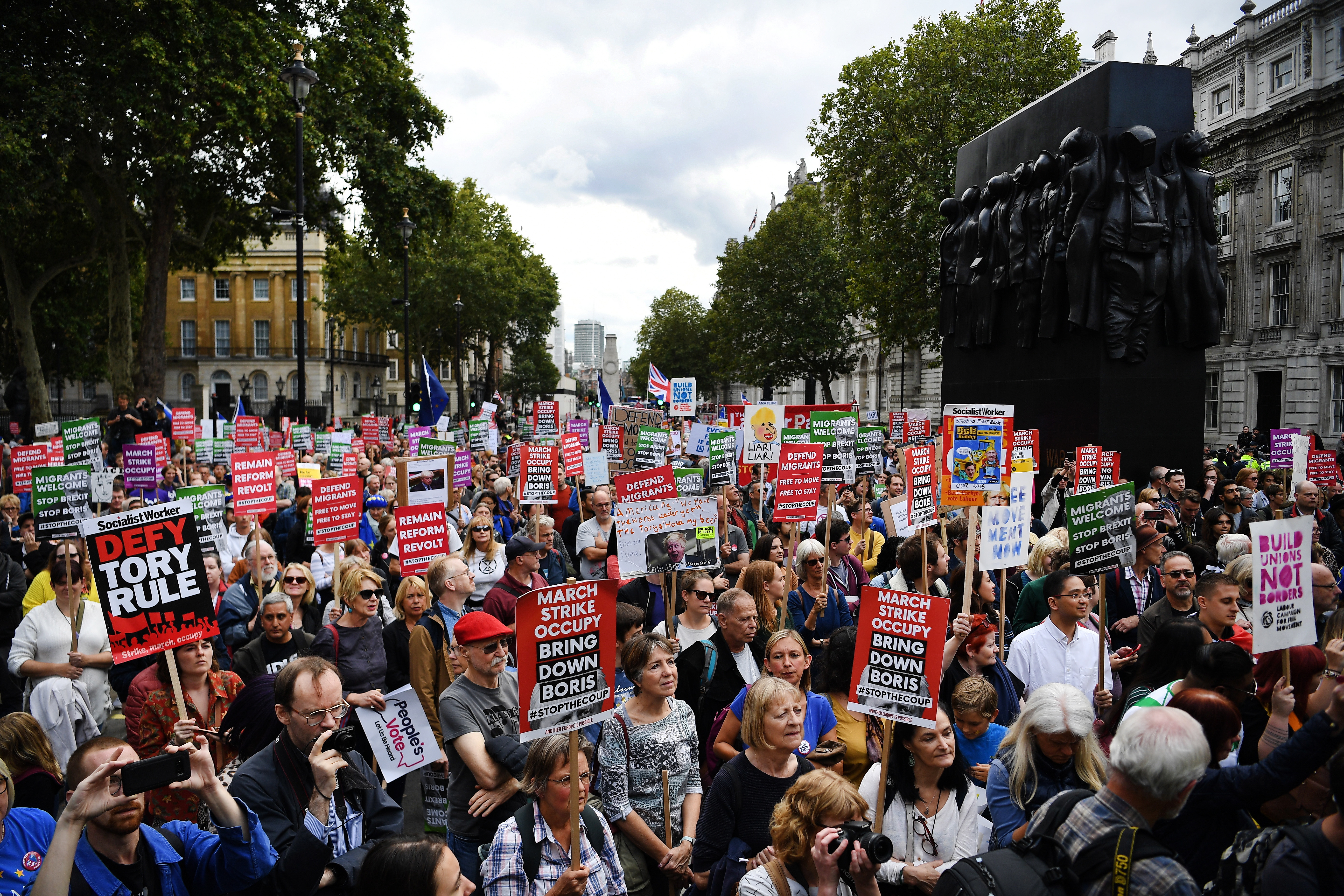 epa07825570 People protest against the government of British Prime Minister Boris Johnson, in London, Britain, 07 September 2019. The event 'Demand Democracy: Johnson Out! #StopTheCoup' calls for the resignation of British Prime Minister Boris Johnson and an end to his Brexit agenda.  EPA/ANDY RAIN