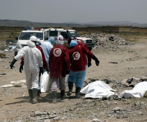 epa07826134 Yemeni Red Crescent staffers carry the body of a detainee at a detention centre targeted a week ago by Saudi-led airstrikes in Dhamar, Yemen, 07 September 2019. According to reports, death toll from Saudi-led airstrikes on a detention centre in central Yemen climbed to 156, after a week of recovering bodies from the rubble.  EPA/STRINGER