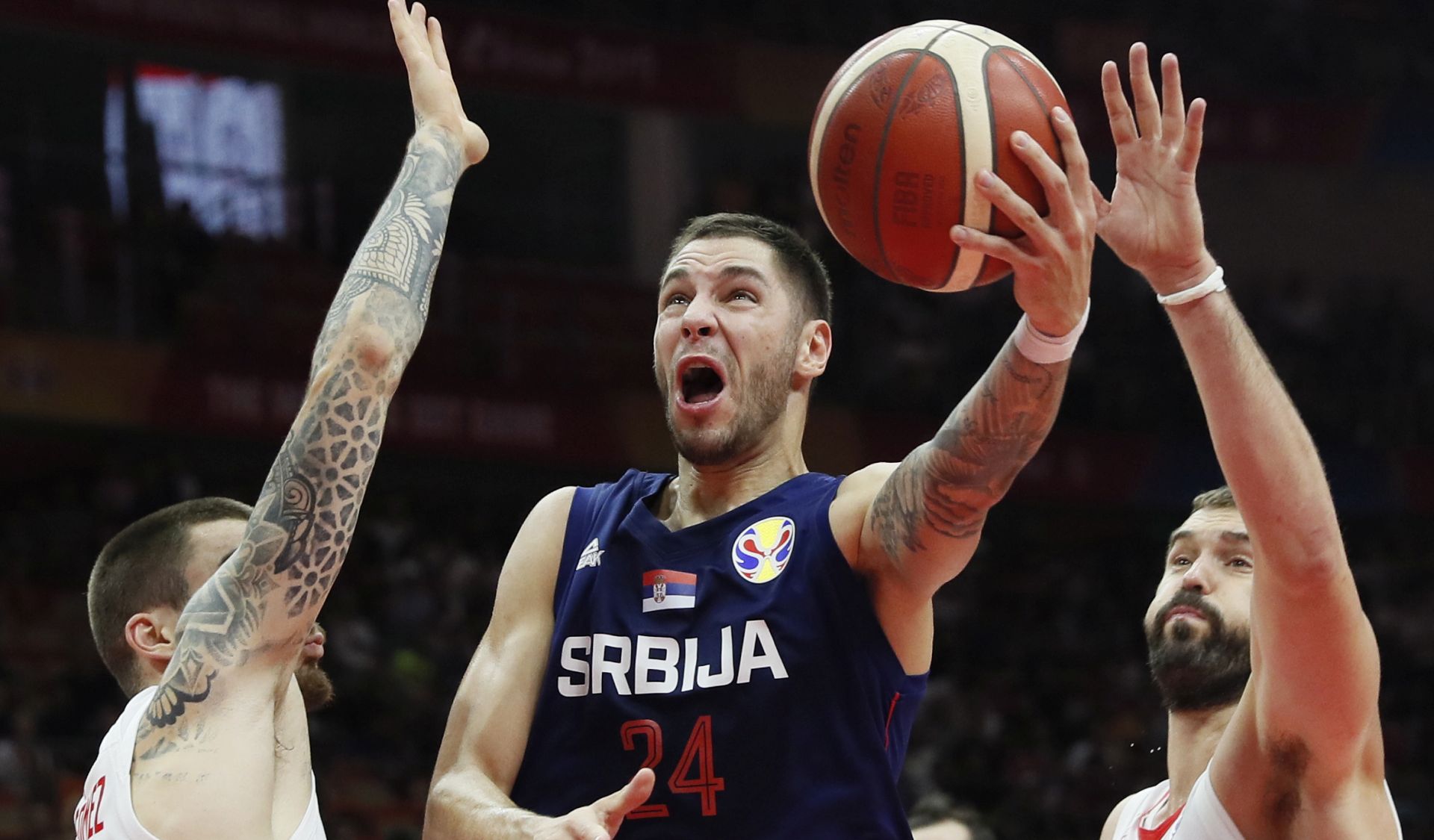 epa07827752 Stefan Jovic (C) of Serbia in action during the FIBA Basketball World Cup 2019 match between Spain and Serbia in Wuhan, China, 08 September 2019.  EPA/MADE NAGI