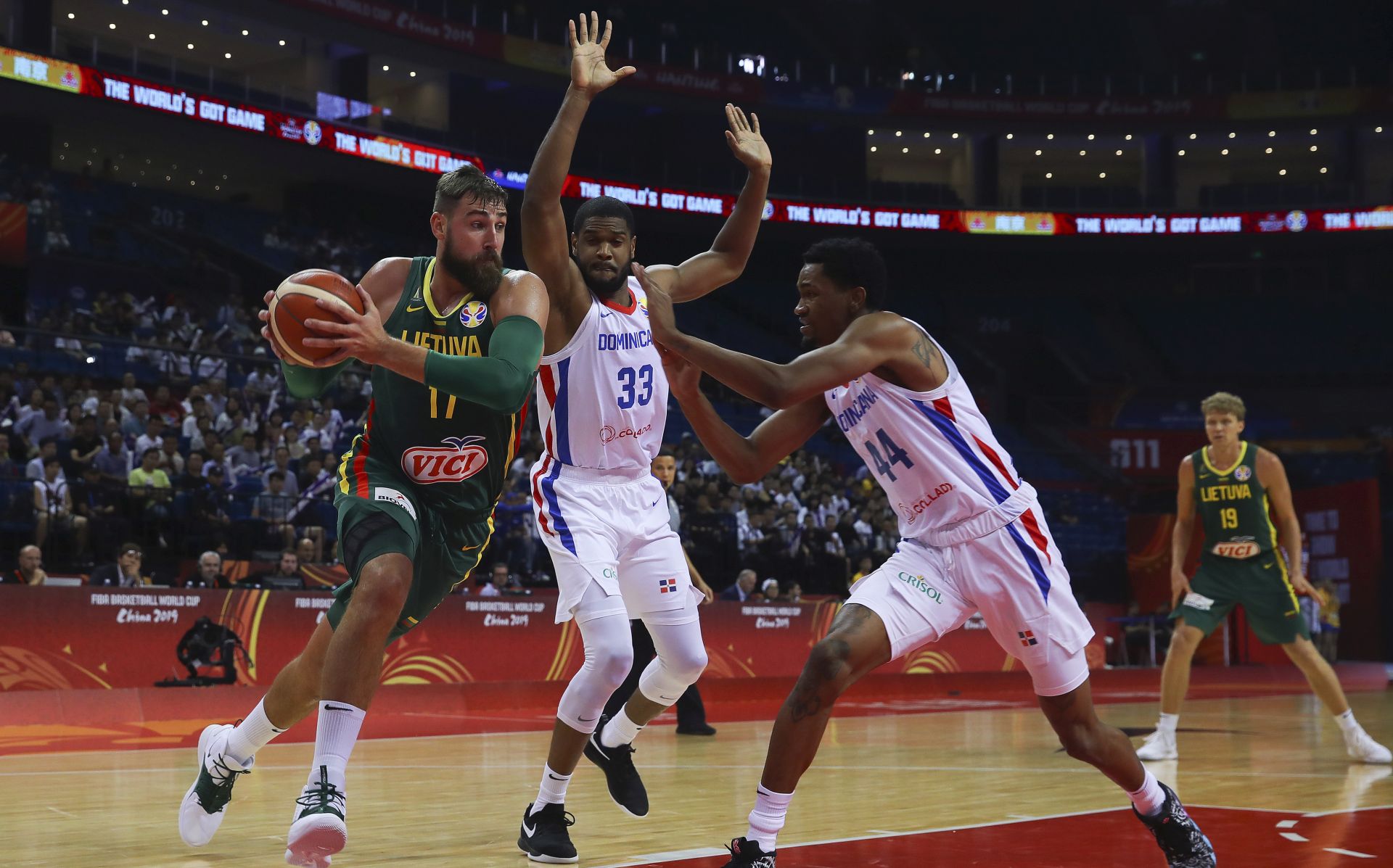 epa07829454 Jonas Valanciunas (L) of  Lithuania in action against Dominican Republic players during the FIBA Basketball World Cup 2019 match between Dominican Republic and Lithuania in Nanjing, China, 09 September 2019.  EPA/FAZRY ISMAIL