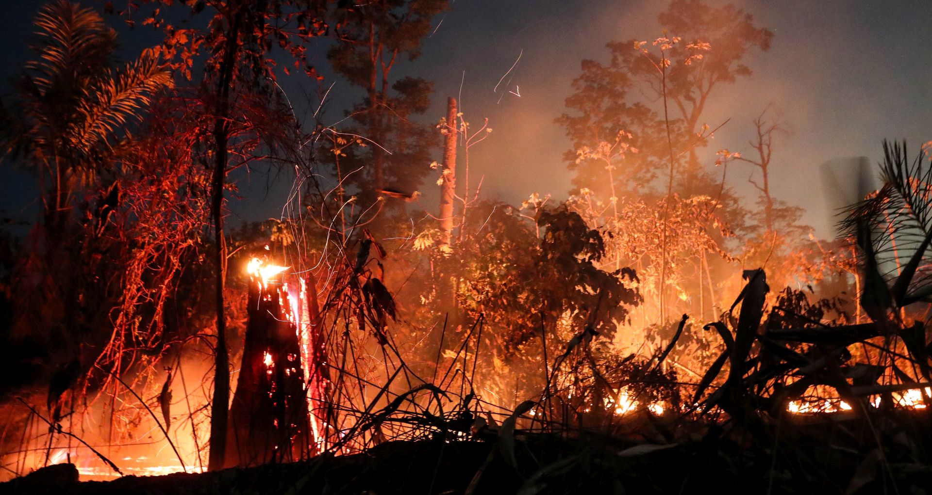 epa07831600 A fire burns in a in Porto Velho, Brazil, 09 September 2019. According to the National Space Research Institute (INPE) of Brazil, the Brazilian Amazon lost 1,698 square kilometers of its vegetation cover in the month of August, an area 222 percent higher than deforested land in the same month of 2018, 526 square kilometers.  EPA/FERNANDO BIZERRA JR