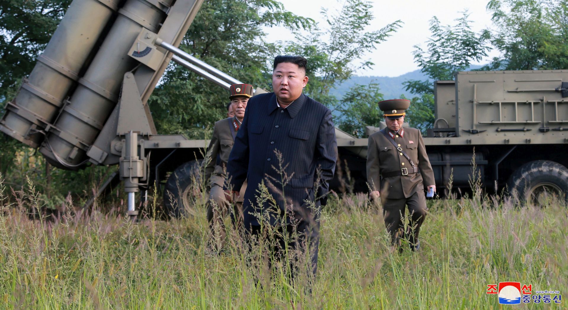 epa07833776 A photo released by the official North Korean Central News Agency (KCNA) shows Kim Jong Un, chairman of the Workers' Party of Korea, chairman of the State Affairs Commission of the Democratic People's Republic of Korea and supreme commander of the armed forces of the DPRK, giving field guidance to the test-fire of a super-large multiple rocket launcher at an unknown location in North Korea, 11 September 2019.  EPA/KCNA   EDITORIAL USE ONLY  EDITORIAL USE ONLY