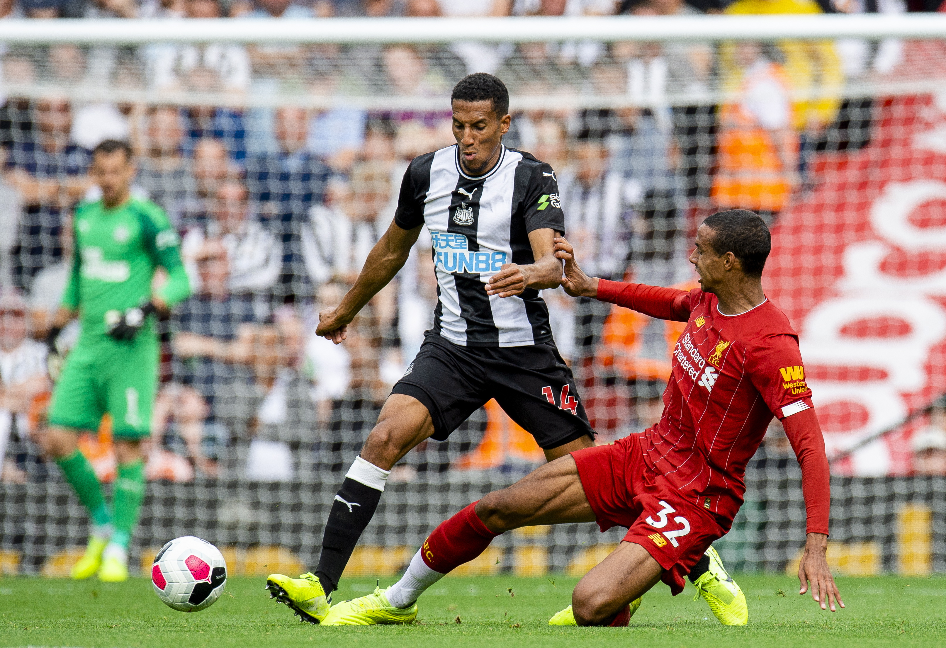 epa07841783 Newcastle's Isaac Hayden (L) in action with Liverpool's Joel Matip (R) during the English Premier League soccer match between Liverpool and Newcastle United held at the Anfield in Liverpool, Britain, 14 September 2019.  EPA/PETER POWELL EDITORIAL USE ONLY. No use with unauthorized audio, video, data, fixture lists, club/league logos or 'live' services. Online in-match use limited to 120 images, no video emulation. No use in betting, games or single club/league/player publications