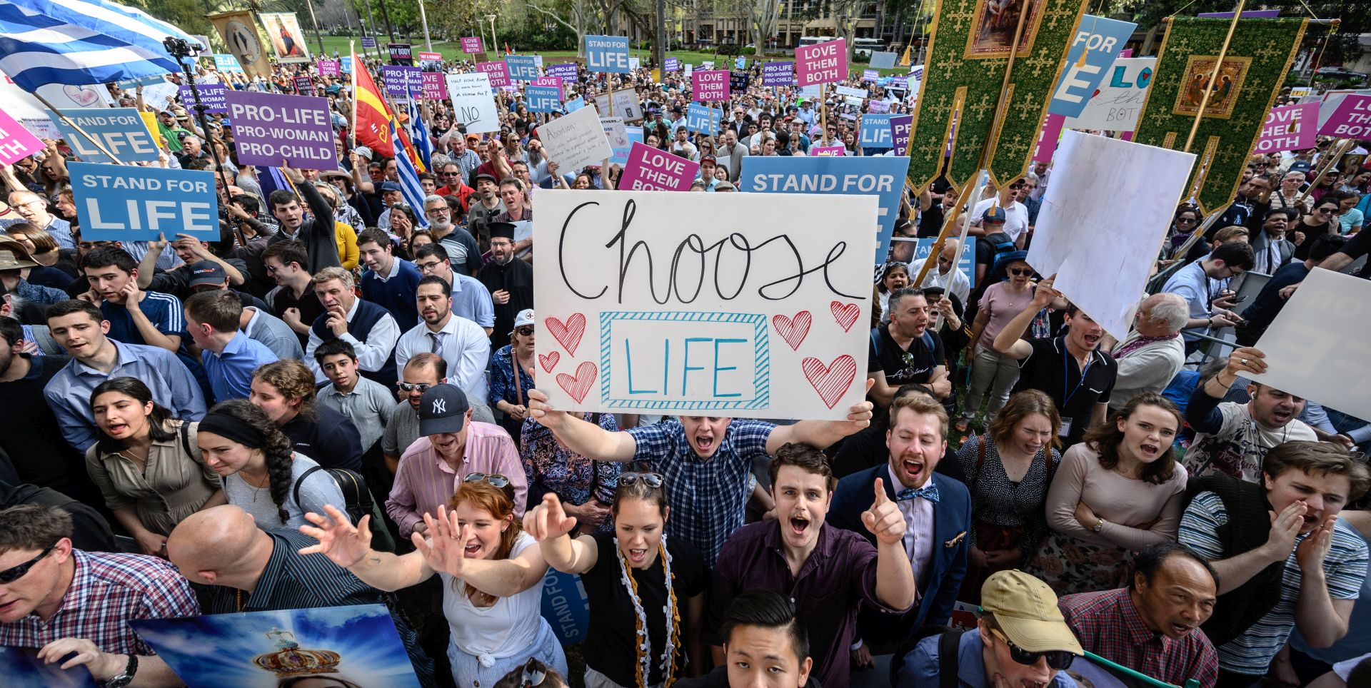 epa07844258 Protesters hold a pro-life banner during an anti-abortion rally in Hyde Park in Sydney, New South Wales, Australia, 15 September 2019. Members of Parliament (MPs) joined pro-life and pro-family groups, women's advocates, faith leaders and thousands of people from across the state to rally against the Reproductive Health Care Reform Bill 2019.  EPA/JAMES GOURLEY  AUSTRALIA AND NEW ZEALAND OUT