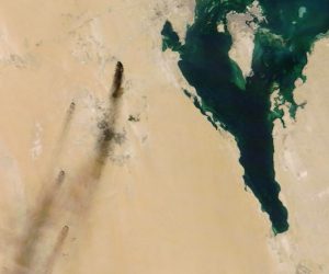 epa07844126 A handout photo made available by NASA Worldview shows a satellite image of smoke from fires at two major oil installations in eastern Saudi Arabia, 14 September 2019 (issued 15 September 2019), following alleged drone attacks claimed by Yemen's Houthi rebels. According to Saudi state-owned oil company Aramco, two of its oil facilities in Saudi Arabia, Khurais and Abqaiq, were set on fire on 14 September after allegedly having been targeted by drone attacks. In picture is seen Bahrain (island, top) and Qatar (peninsula, R).  EPA/NASA WORLDVIEW HANDOUT  HANDOUT EDITORIAL USE ONLY/NO SALES