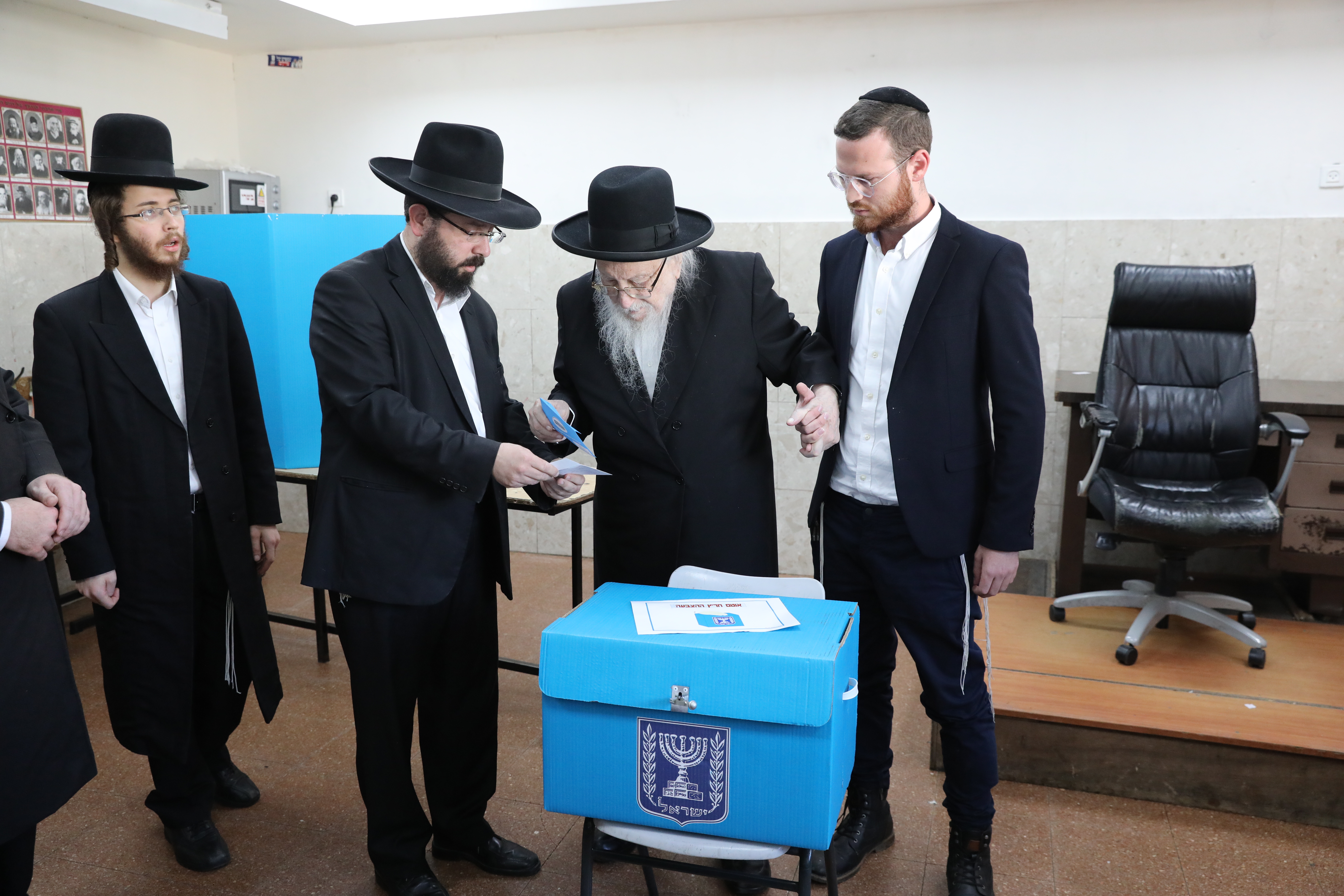 epa07847855 Ultra-Orthodox Jews cast their ballots at polling station during the Israeli legislative elections, in Jerusalem, Israel, 17 September 2019. Israelis are heading to the polls for a second general election, following the prior elections in April 2019, to elect the 120 members of the 22nd Knesset, or parliament. According to the Israel Central Bureau of Statistics, about six million people are eligible to vote.  EPA/ABIR SULTAN