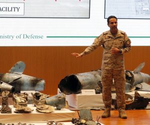 epa07851090 Saudi Defense Ministry spokesman Colonel Turki Al-Malik addresses a press conference next to the remains of the missiles allegedly used in the attack against Aramco oil facility, Riyadh, Saudi Arabia, 18 September 2019. According to reports, Al-Malik said 25 Iranian-made drones came from the north to attack the facility, and showed what the Saudis said were the remains of cruise missiles and drones used in an attack.  EPA/STRINGER