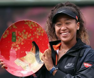 epaselect epa07860423 Naomi Osaka of Japan shows off the winner's plate after winning the women's singles final over Anastasia Pavlyuchenkova of Russia in the Pan Pacific Open tennis tournament in Osaka, western Japan, 22 September 2019.  EPA/JIJI JAPAN OUT EDITORIAL USE ONLY/  NO ARCHIVES
