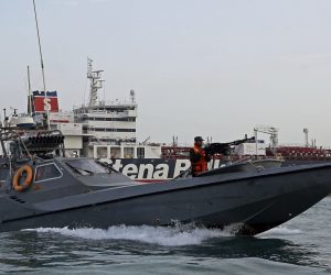 epa07863708 (FILE) - Iran's Revolutionary Guard jet boat patrols around the detained British-flagged tanker Stena Impero in Bandar Abbas, southern Iran, 21 July 2019 (reissued 23 September 2019). Media report on 23 September state that Iranian government spokesman Ali Rabiei announced that the British-flagged Oil tanker Stena Impero is free to leave Iran.  Iranian Revolutionary Guard Corps (IRGC) claims to have seized Stena Impero at the Strait of Hormuz with 23 crew on board on 19 July 2019.  EPA/HASAN SHIRVANI