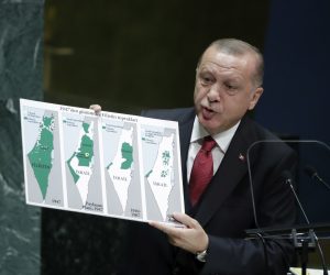 epa07866584 Turkish President Recep Tayyip Erdogan, holds a map showing the evolution of Israel and Palestinian state from 1947 as he addresses the general debate of the 74th session of the General Assembly of the United Nations at United Nations Headquarters in New York, New York, USA, 24 September 2019. The annual meeting of world leaders at the United Nations runs until 30 September 2019.  EPA/JASON SZENES
