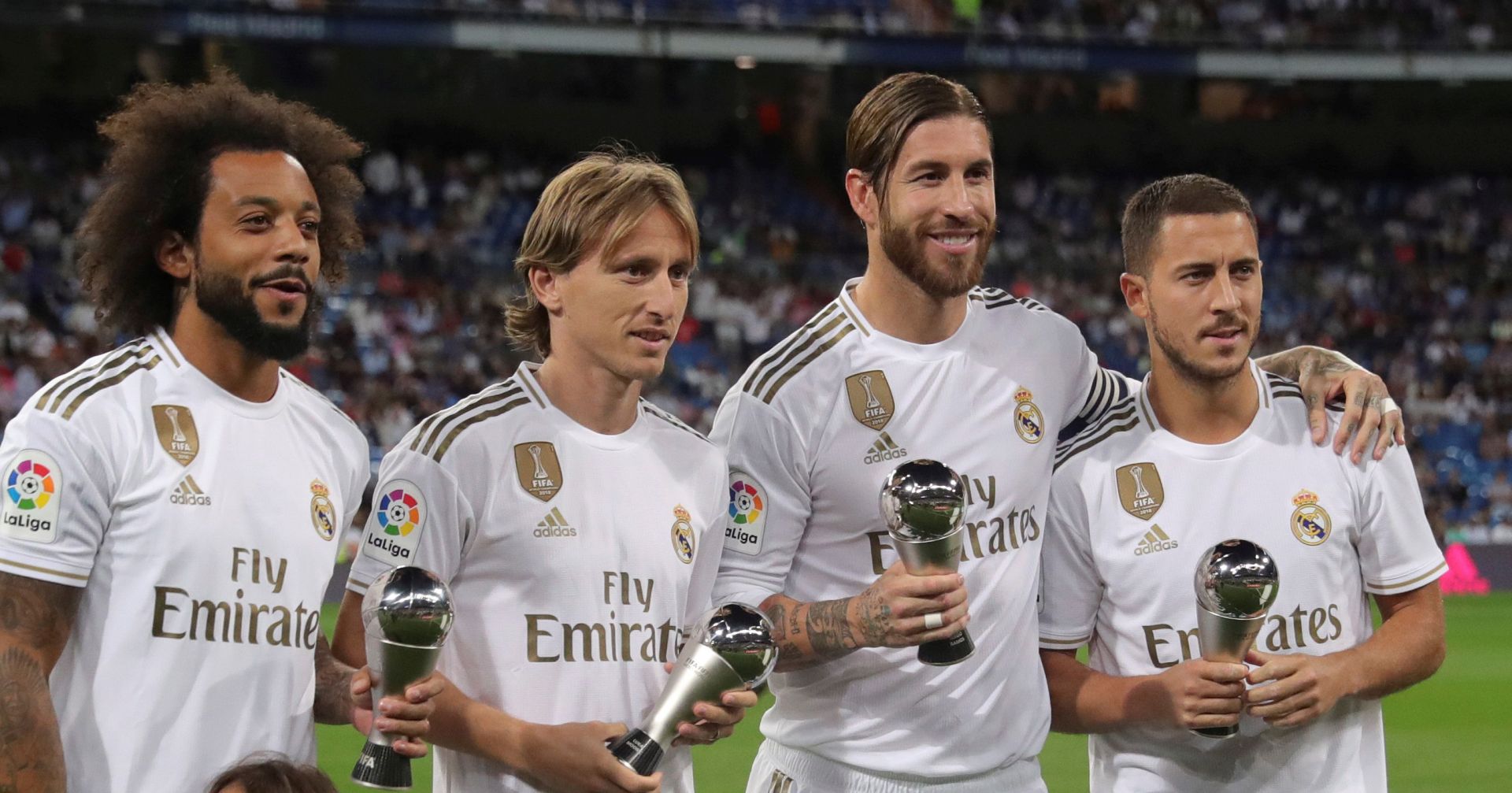 epa07869269 Real Madrid's players (L-R) Marcelo, Luka Modric, Sergio Ramos and Eden Hazard pose for the media with their awards after been elected at FIFA's FIFPro World XI, before the Spanish LaLiga match between Real Madrid and CA Osasuna at Santiago Bernabeu stadium in Madrid, Spain, 25 September 2019.  EPA/JuanJo Martin