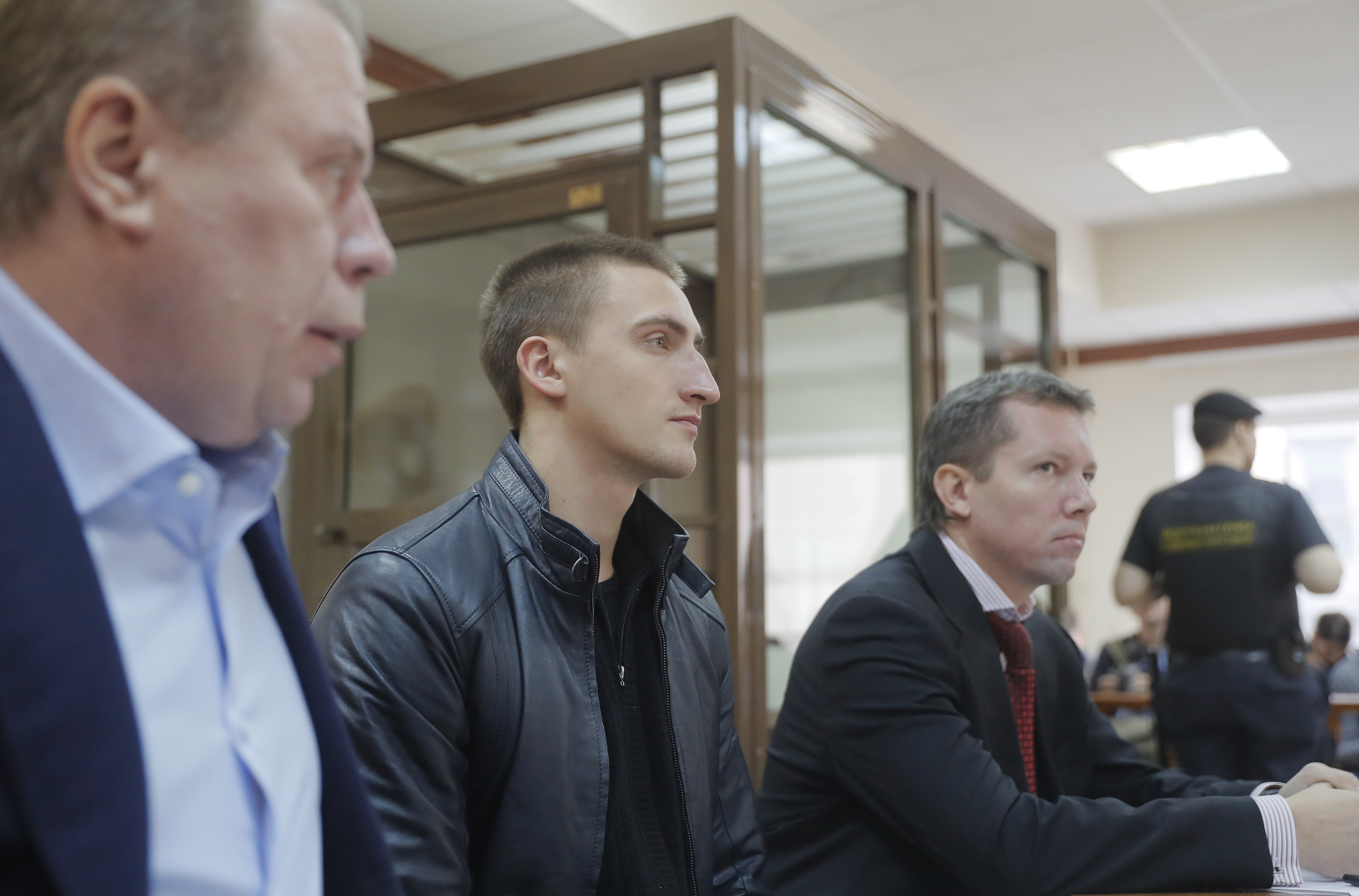 epa07870128 Russian actor Pavel Ustinov (C), sentenced to 3.5 years of penal colony for his resistance to police during a protest action, and loyer Pavel Kucherena (L) attend a session of Moscow City Court, in Moscow, Russia, in Moscow, Russia, 26 September 2019. The Moscow's Tverskoy district Court sentenced actor Pavel Ustinov to three and a half years in a penal colony after his arrest during an opposition rally in Moscow on 03 August. Mass protests of his colleagues, teachers, priests and other people caused by obviously unfair penalty demand to review his case and to cancel sentence. One week ago Moscow City Court has considered the appeal for the release of actor Pavel Ustinov from the pre-trial detention centre and ruled to free him under the pledge not to leave the country. Today the court verifies the validity of the sentence imposed on actor Pavel Ustinov.  EPA/SERGEI ILNITSKY