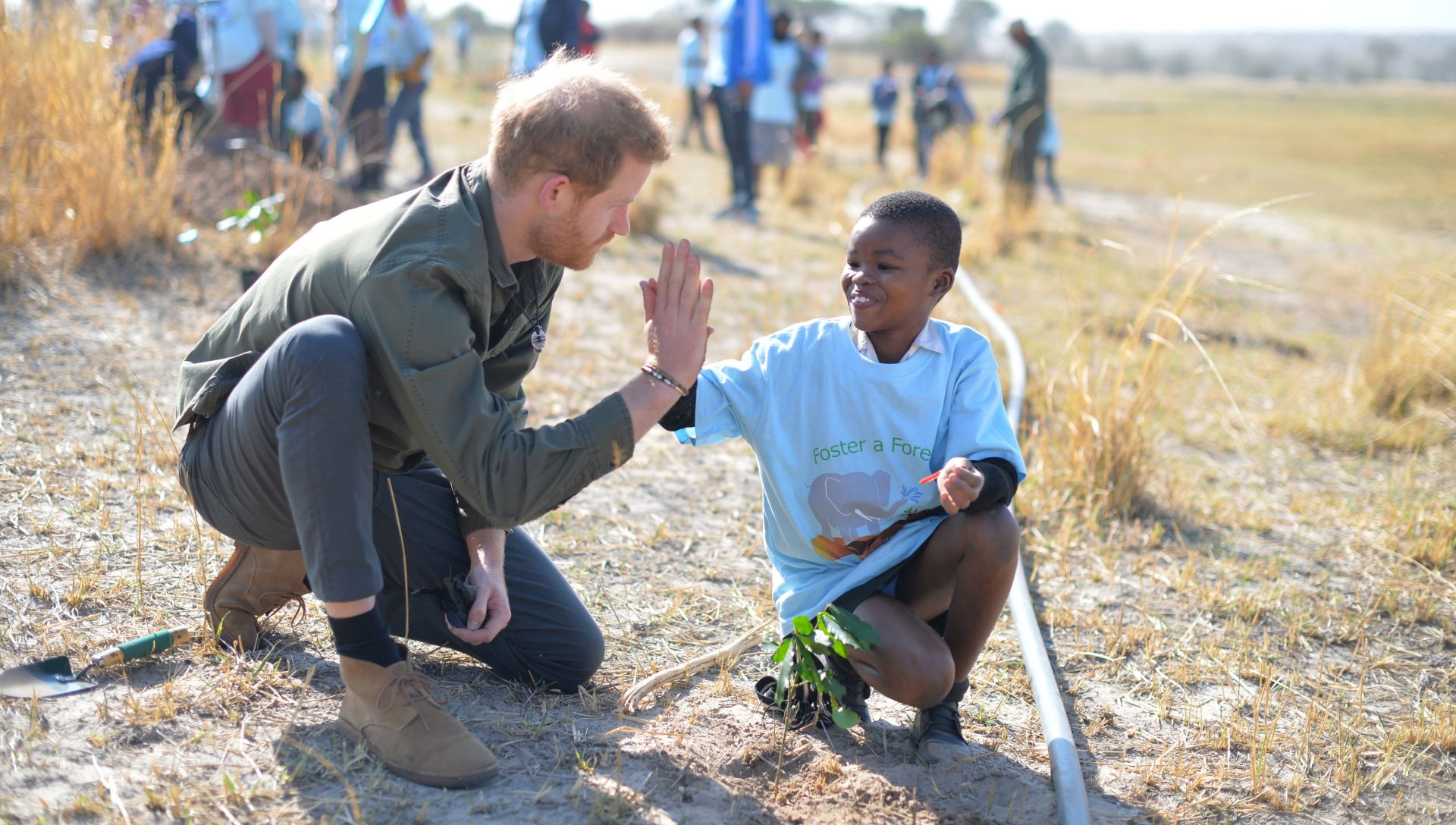 epa07870158 The Duke of Sussex helps local schoolchildren plant trees at the Chobe Tree Reserve, Kasane, Botswana 26 September 2019. Chobe National Park in is home to Africa’s largest elephant population (more than 17,000) and comprises more than 10,000km2 of rich ecosystems, diverse landscapes and an abundance of wildlife and birdlife who depend on the Chobe River as a critical source of water. The Duke and Duchess of Sussex are on an official visit to South Africa.  EPA/DOMINIC LIPINSKI / PA PHOTOS / POOL