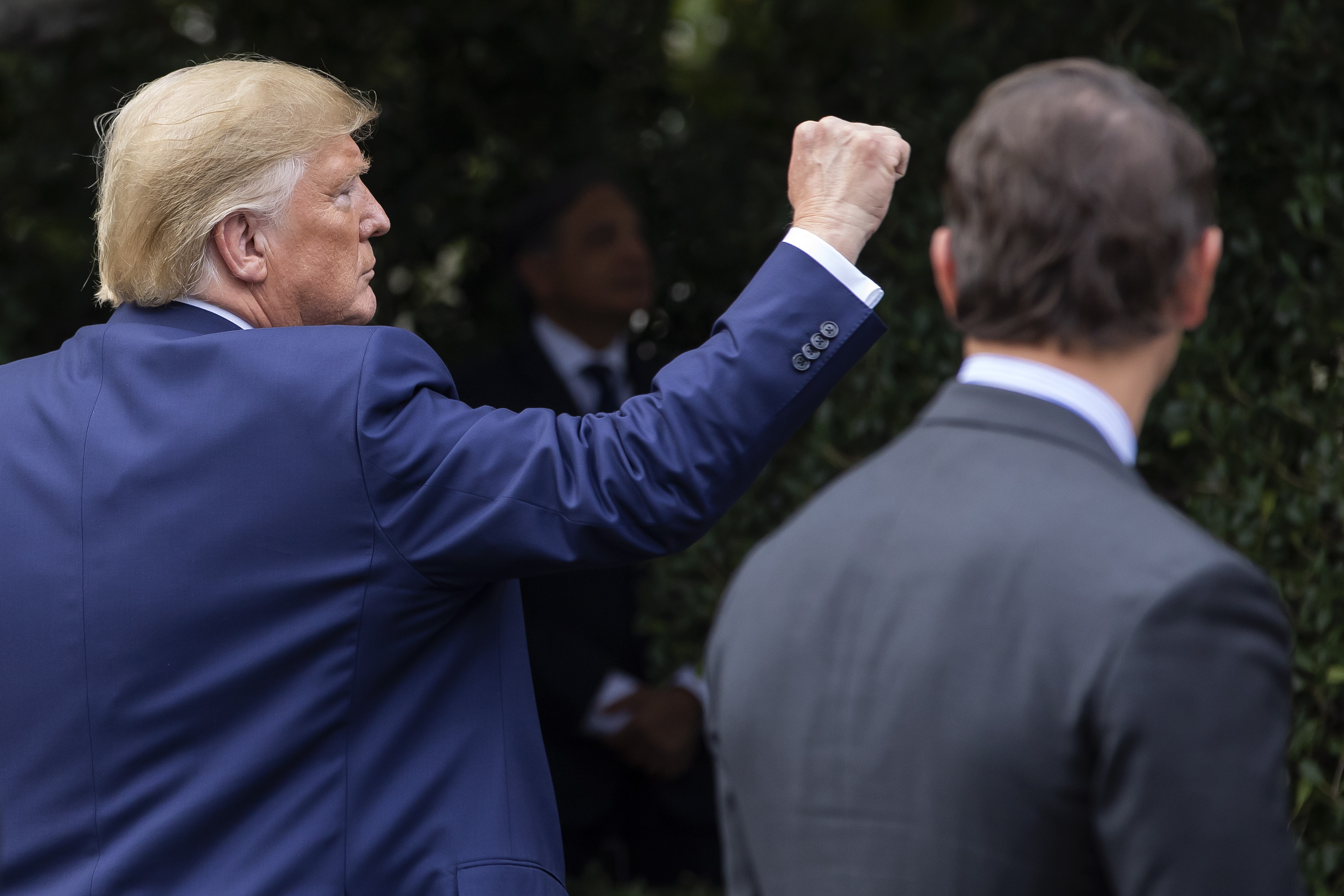 epa07872412 US President Donald J. Trump reacts after receiving a plaque for his efforts to stop illegal immigration from a group of US sheriffs at the South Portico of the White House in Washington, DC, USA, 26 September 2019.  EPA/ERIK S. LESSER