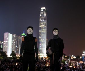 epa07876222 Anti-government protesters wearing Guy Fawkes masks take part in a flash mob commemorating the 5th anniversary of the 'Umbrella Revolution' in Hong Kong, China, 28 Sept. 2019. In 2014 the series and sit-ins and protests, nicknamed the Umbrella Revolution or Umbrella Movement, began after China's Standing Committee of the National People's Congress issued a decision regarding proposed reforms to the Hong Kong electoral system. Hong Kong has entered its fourth month of mass protests, originally triggered by a now suspended extradition bill to mainland China that have turned into a wider pro-democracy movement.  EPA/FAZRY ISMAIL