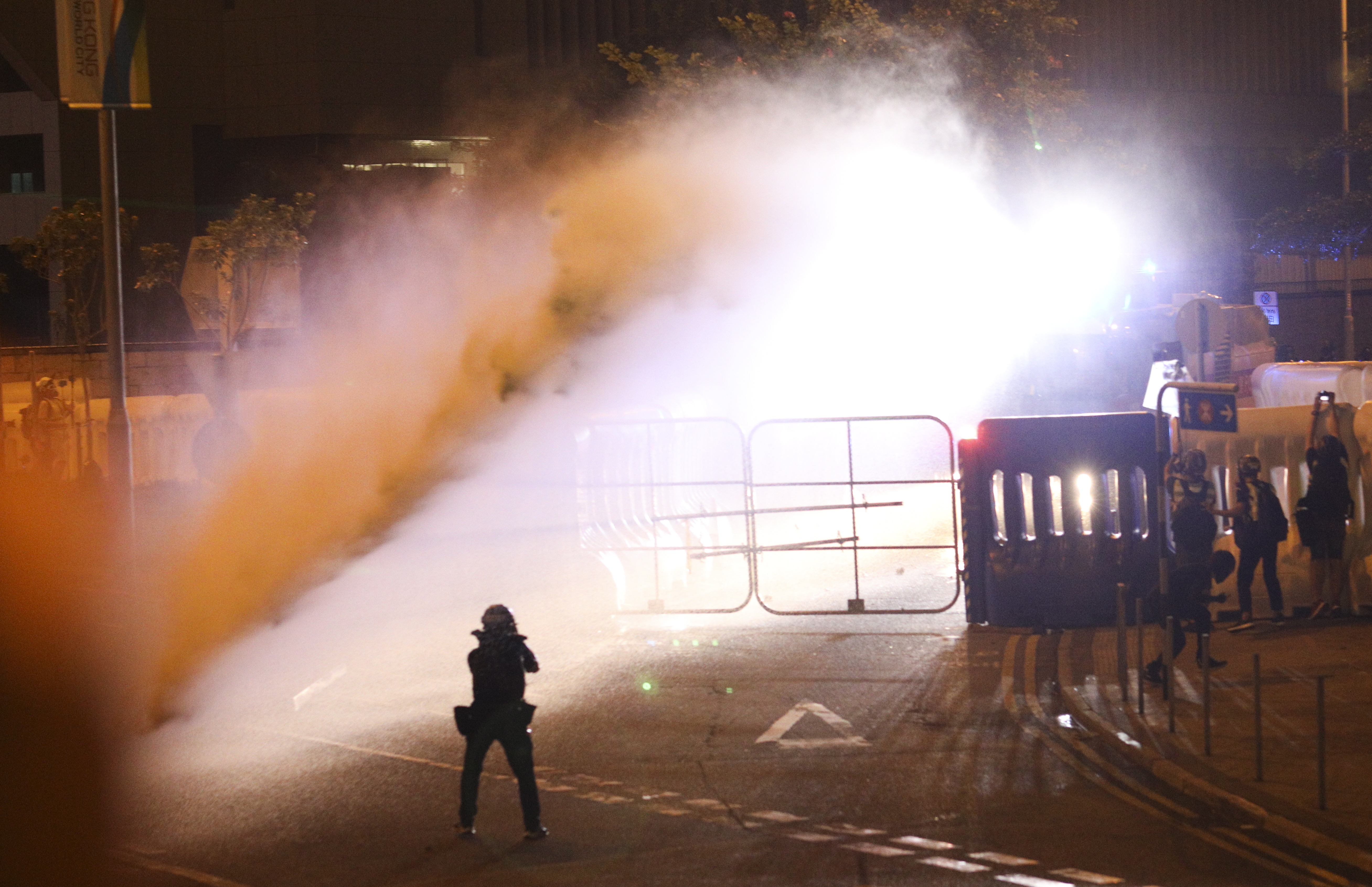 epa07876363 Police fire water canon toward protesters during a rally commemorating the 5th anniversary of the 'Umbrella Revolution' in Hong Kong, China, 28 Sept. 2019. In 2014 a series and sit-ins and protests, nicknamed the 'Umbrella Revolution' or 'Umbrella Movement', began after China's Standing Committee of the National People's Congress issued a decision regarding proposed reforms to the Hong Kong electoral system. Hong Kong has entered its fourth month of mass protests, originally triggered by a now suspended extradition bill to mainland China that have turned into a wider pro-democracy movement.  EPA/JEROME FAVRE