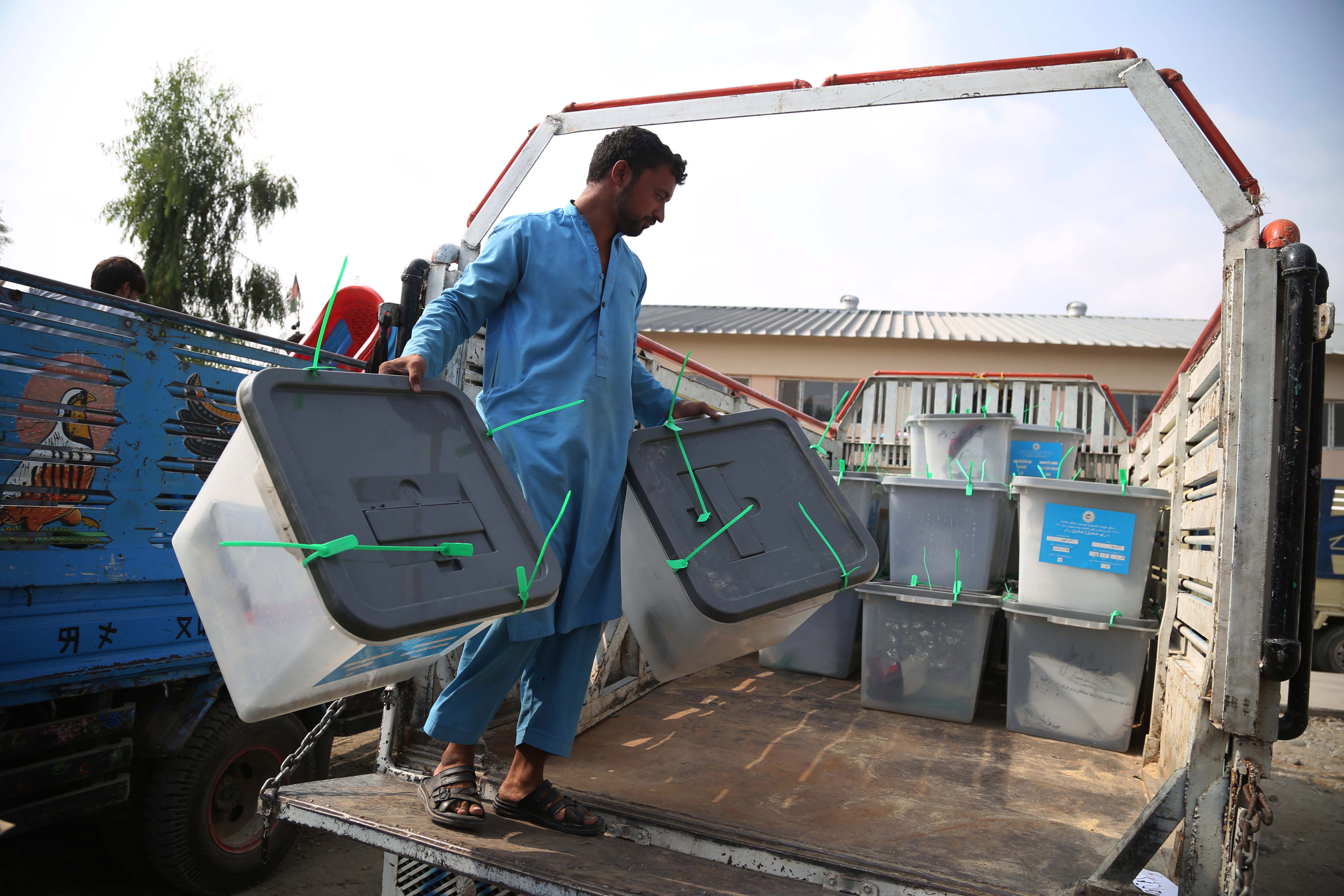 epa07878716 Election workers move ballot boxes to an Independent Election Commission (IEC) warehouse a day after presidential elections, in Jalalabad, Afghanistan, 29 September 2019. The Afghan presidential elections took place nationwide on 28 September amidst a maximum security alert due to the threat of violence by Taliban insurgents. A national peace and a stronger economy were Afghan voters' main concerns as the country headed to the polls for its fourth presidential election since the fall of the Taliban regime in 2001.  EPA/GHULAMULLAH HABIBI